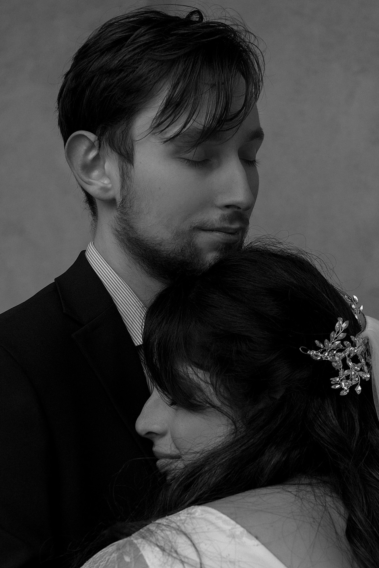 Tender hug between bride and groom