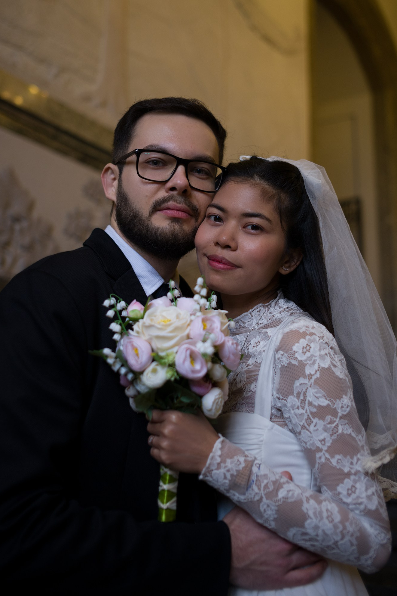 Bride and groom sharing a quiet moment inside Copenhagen City Hall