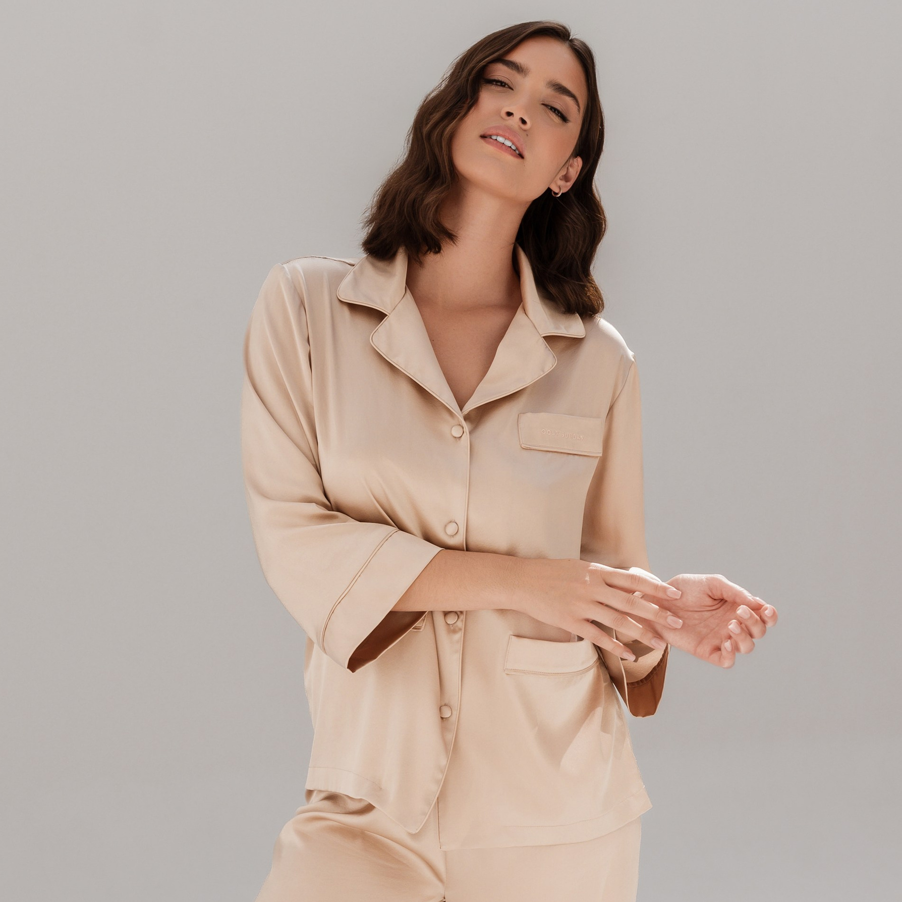 High-end editorial lookbook shoot featuring designer fashion styled in a modern studio.