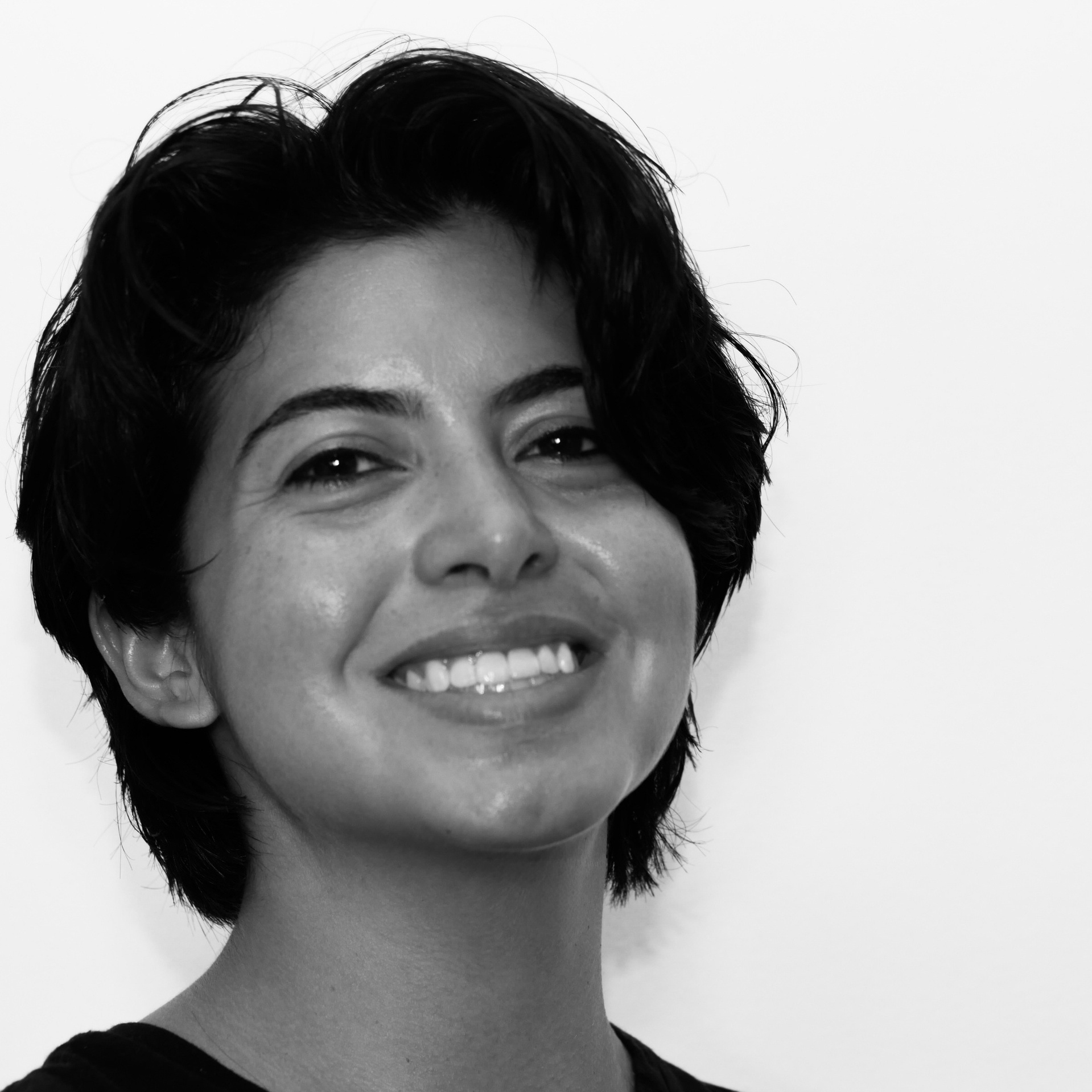 Black and white headshot image of the owner.