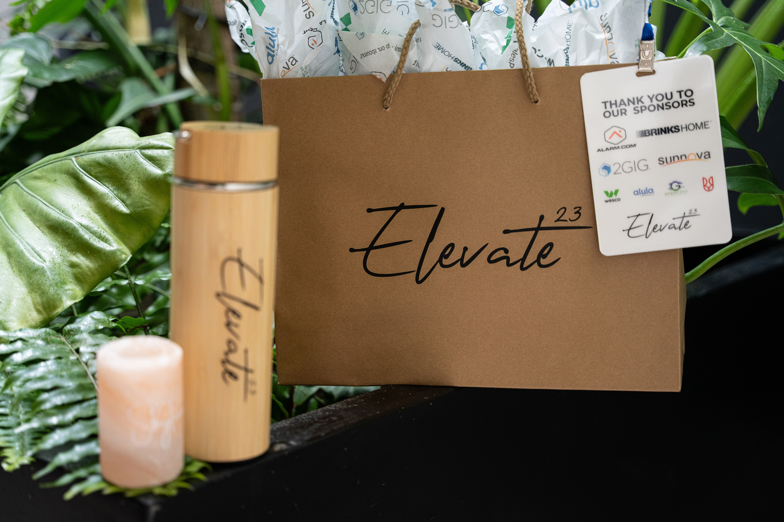 Branded corporate merchandise displayed on a table for event attendees.