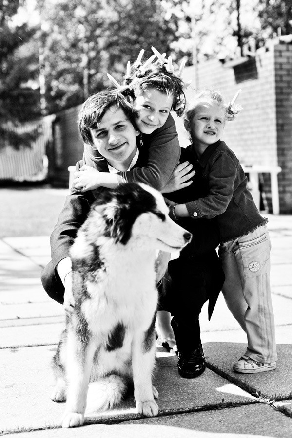 Wedding photographer for booking in Amsterdam and Brussels, Groom during preparations with children and dog in his mansion