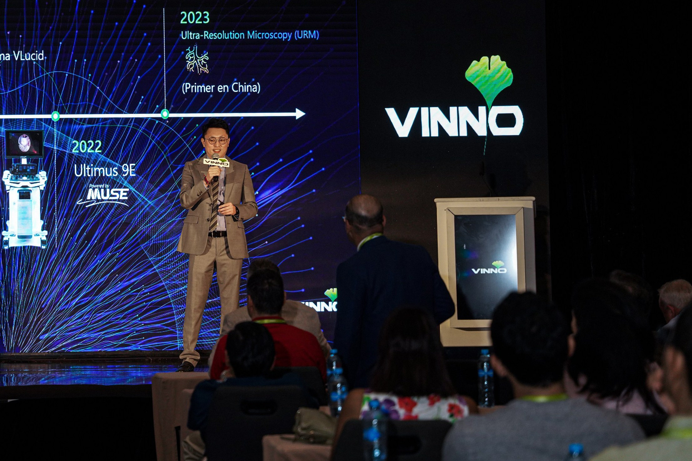 Corporate keynote speaker addressing employees during a business conference.