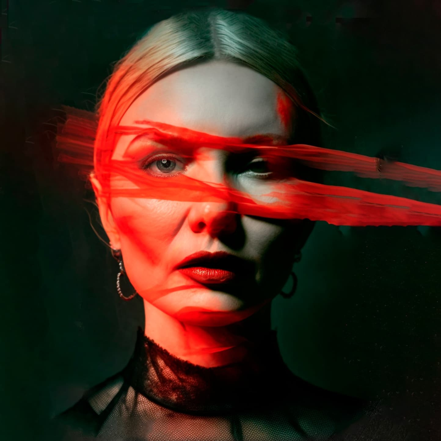Conceptual self-portrait using projected red light and layered imagery to explore identity, fragmentation and inner transformation.
