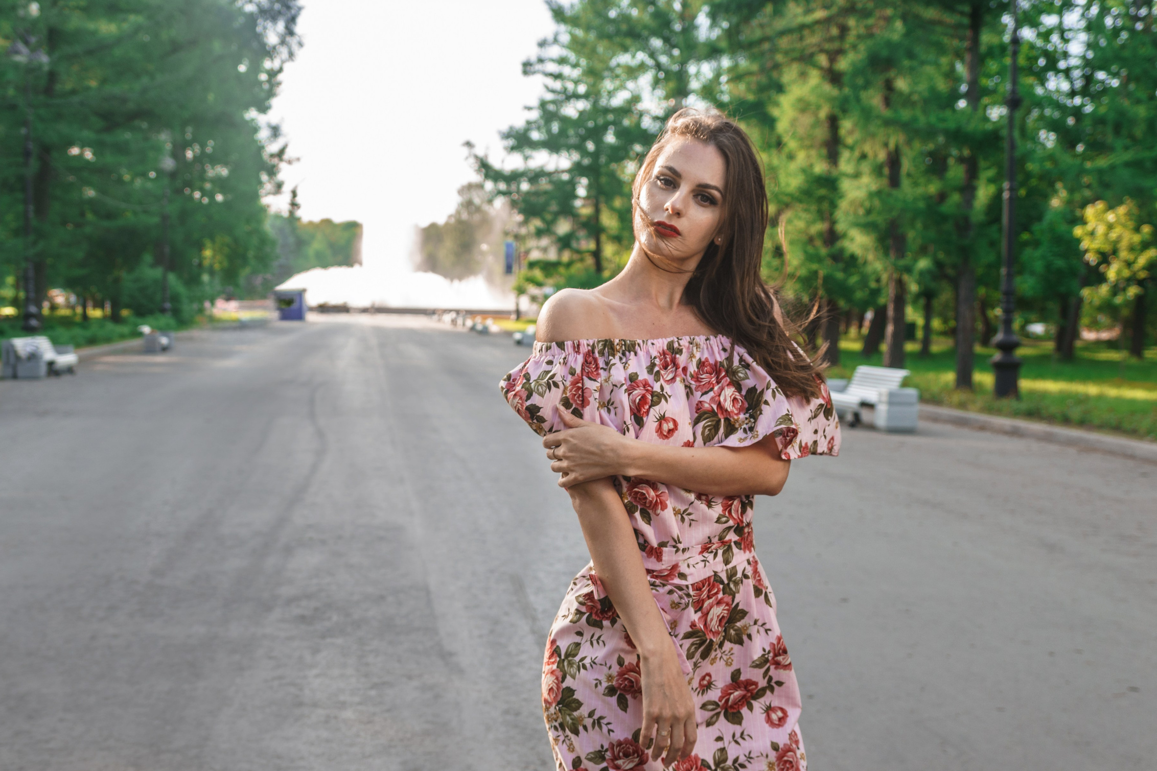 Woman with long hair in a beautiful light summer dress in a park – outdoor photo session