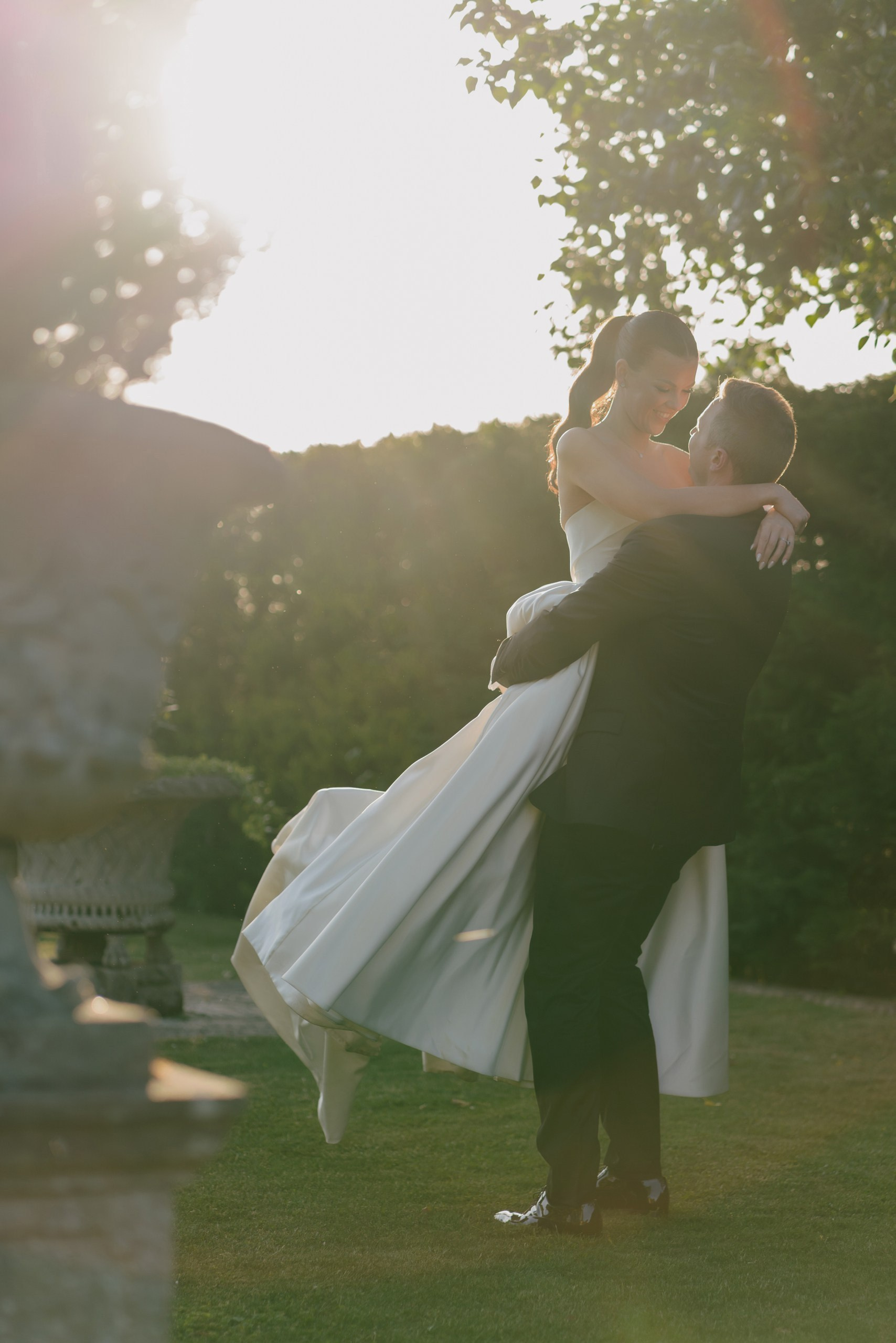 Bride and groom walking outdoors during sunset wedding portraits