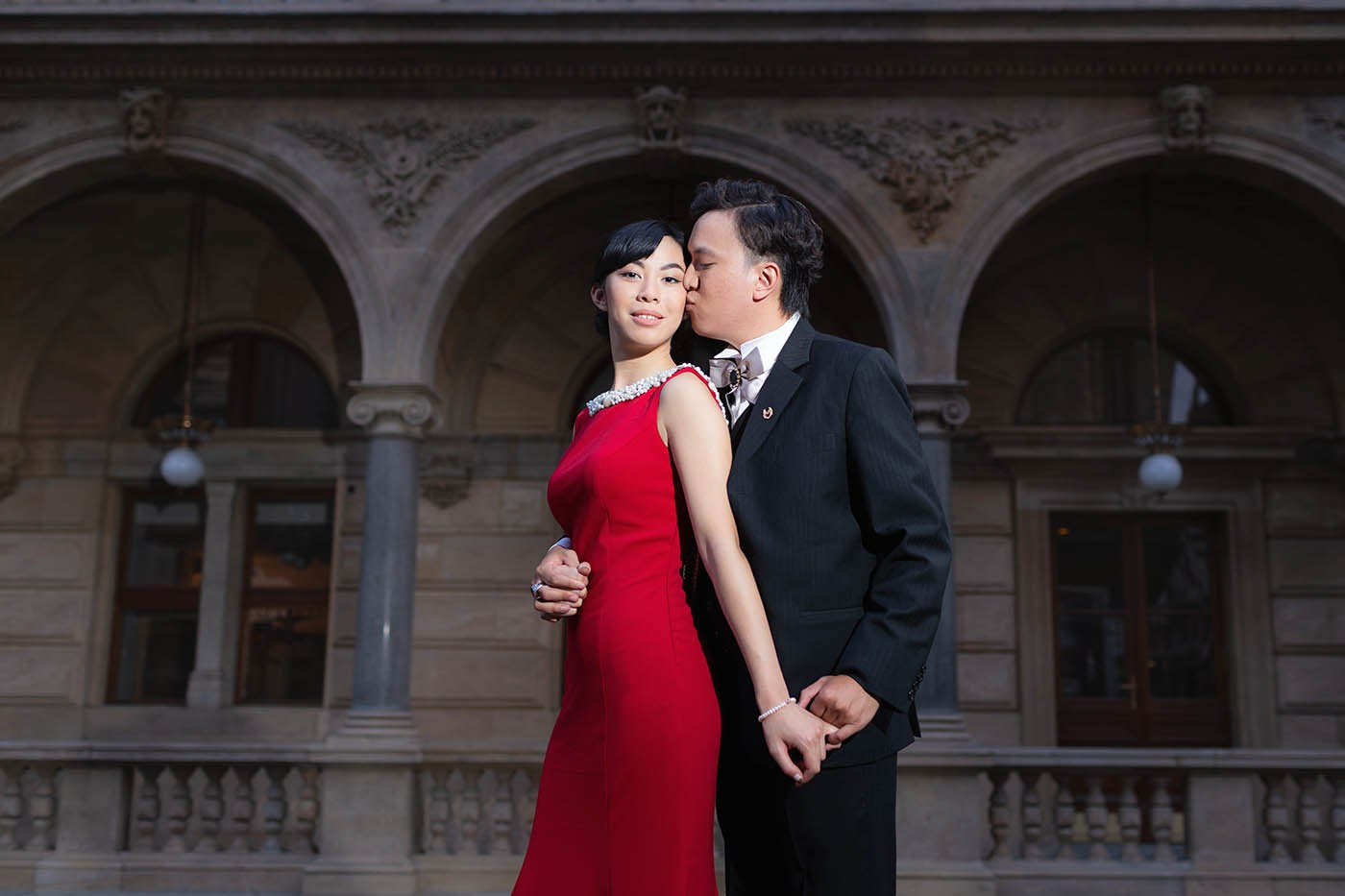 A chic and elegant couple from Macau pose near Narodni Divadlo in Prague during their pre-wedding