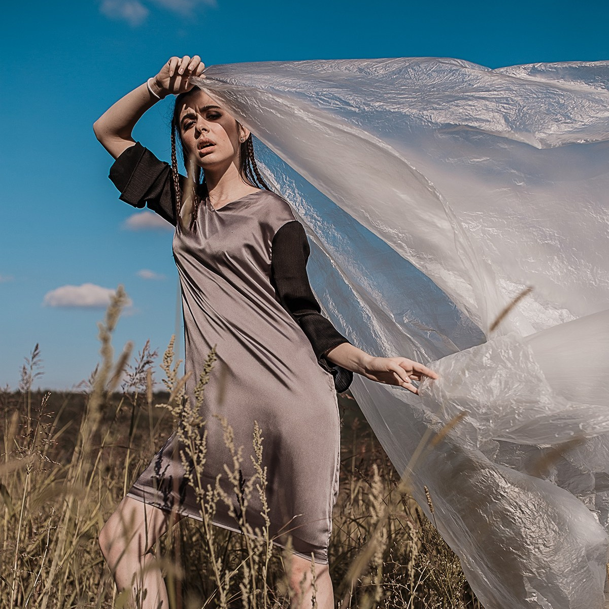 Designer's dress on the model. model is on the field 