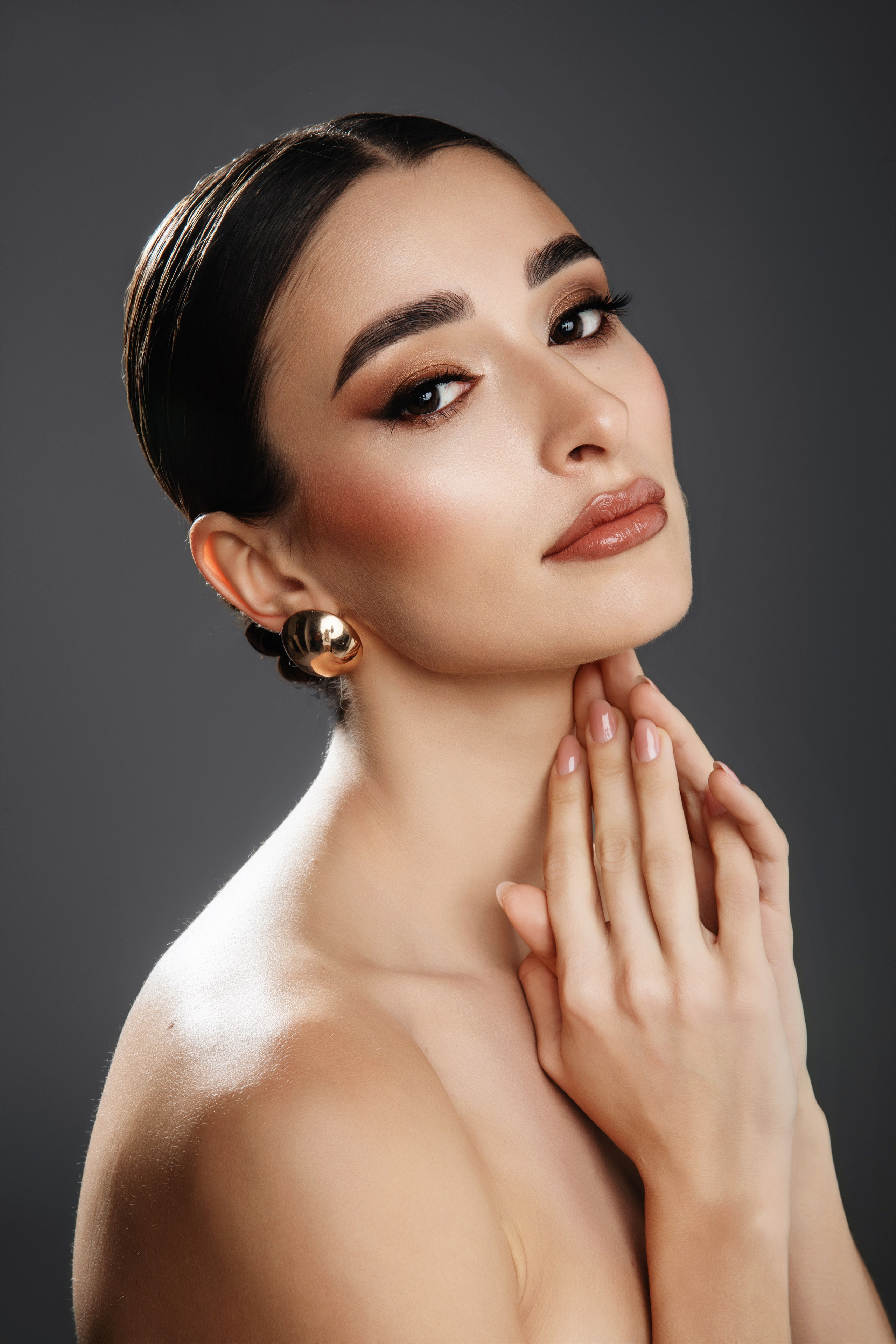 Professional fashion makeup with polished hairstyle