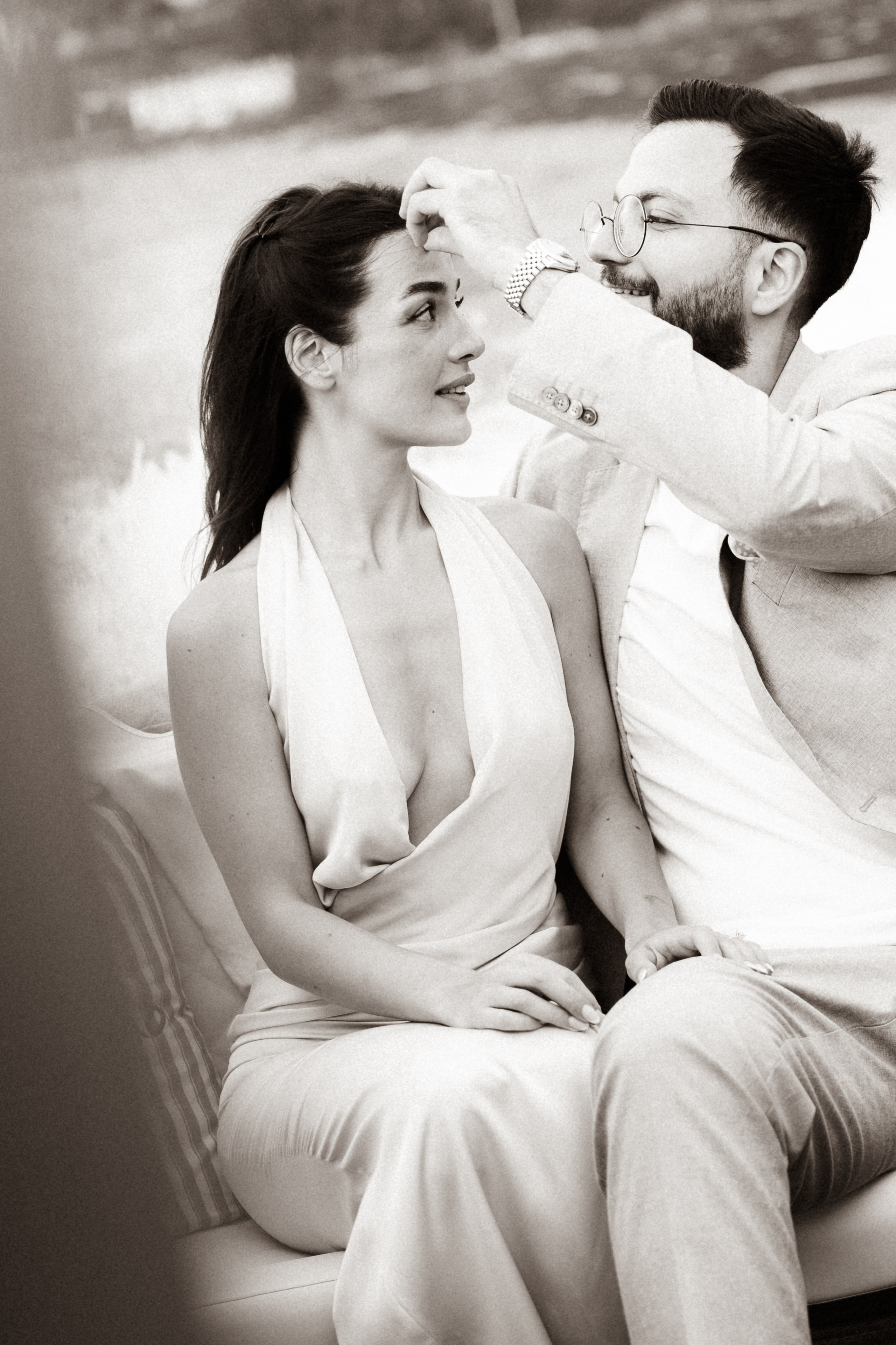 Newly engaged couple looking at each other during a romantic Lake Como engagement