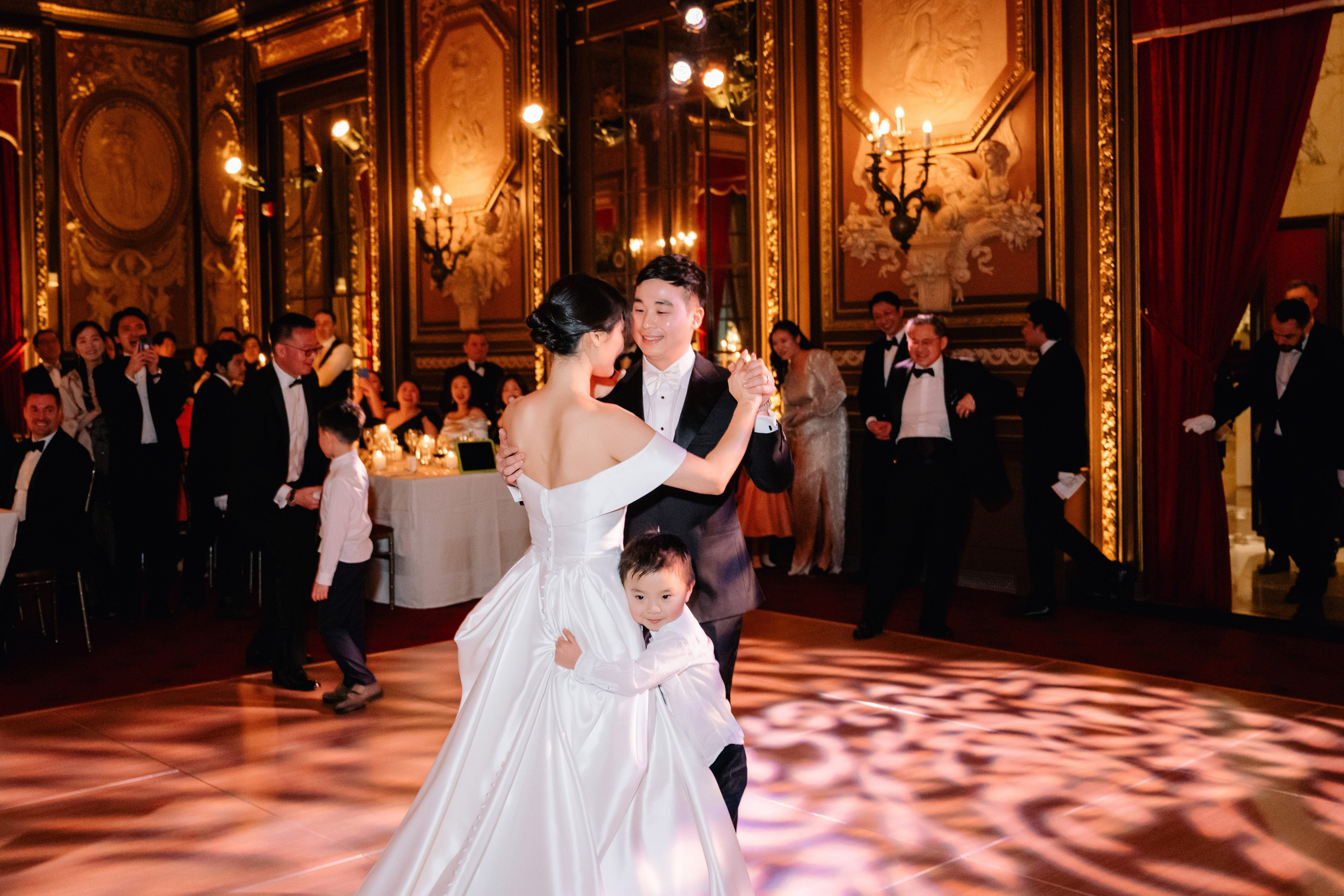 a bride and groom dancing on a dance floor