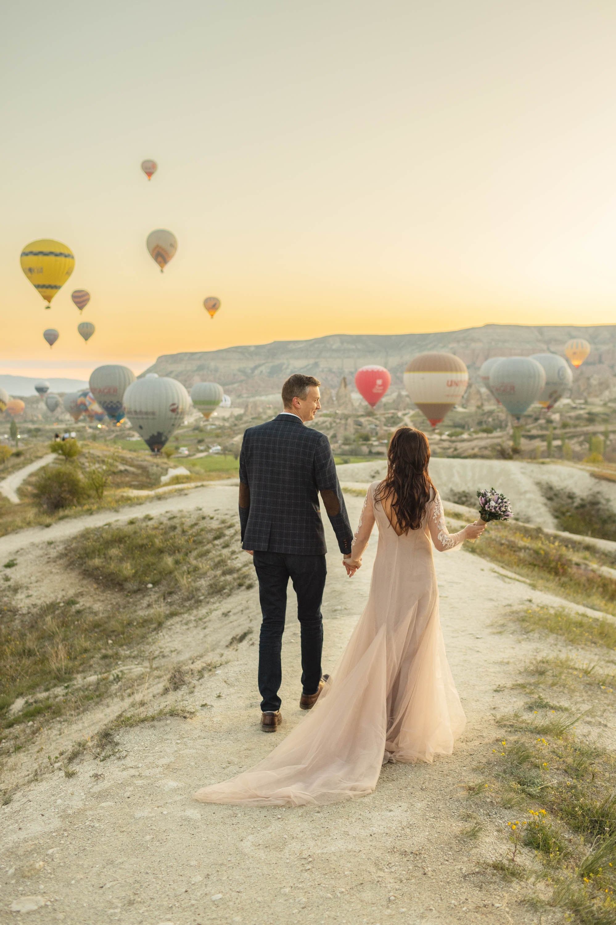 Magical Wedding Photoshoot in Cappadocia: Balloons, Caves, and Valleys. Julia Ganch I Fashion Wedding Photography I Cappadocia Turkey