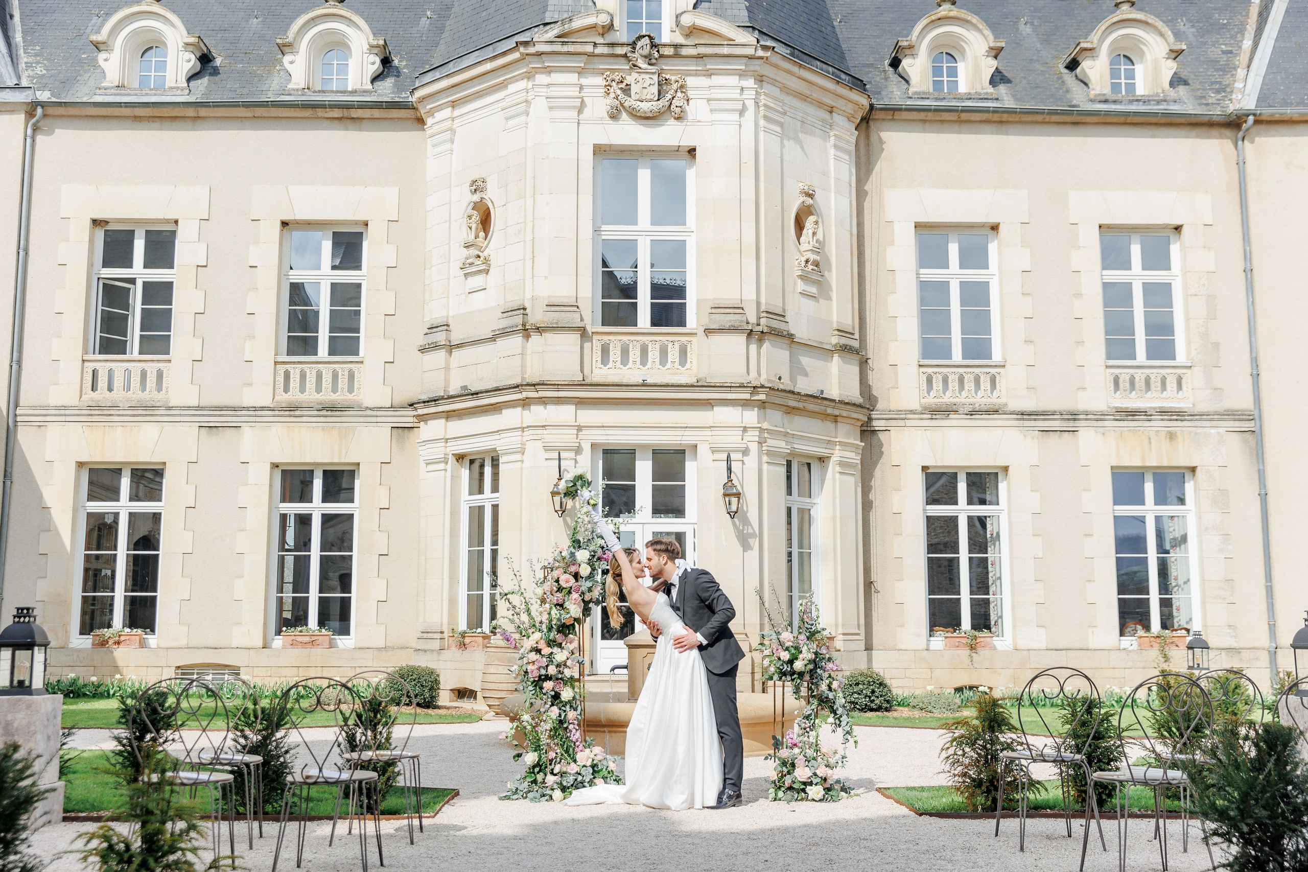 Charming chateau in France featuring vibrant flowers and a serene atmosphere for outdoor ceremonies