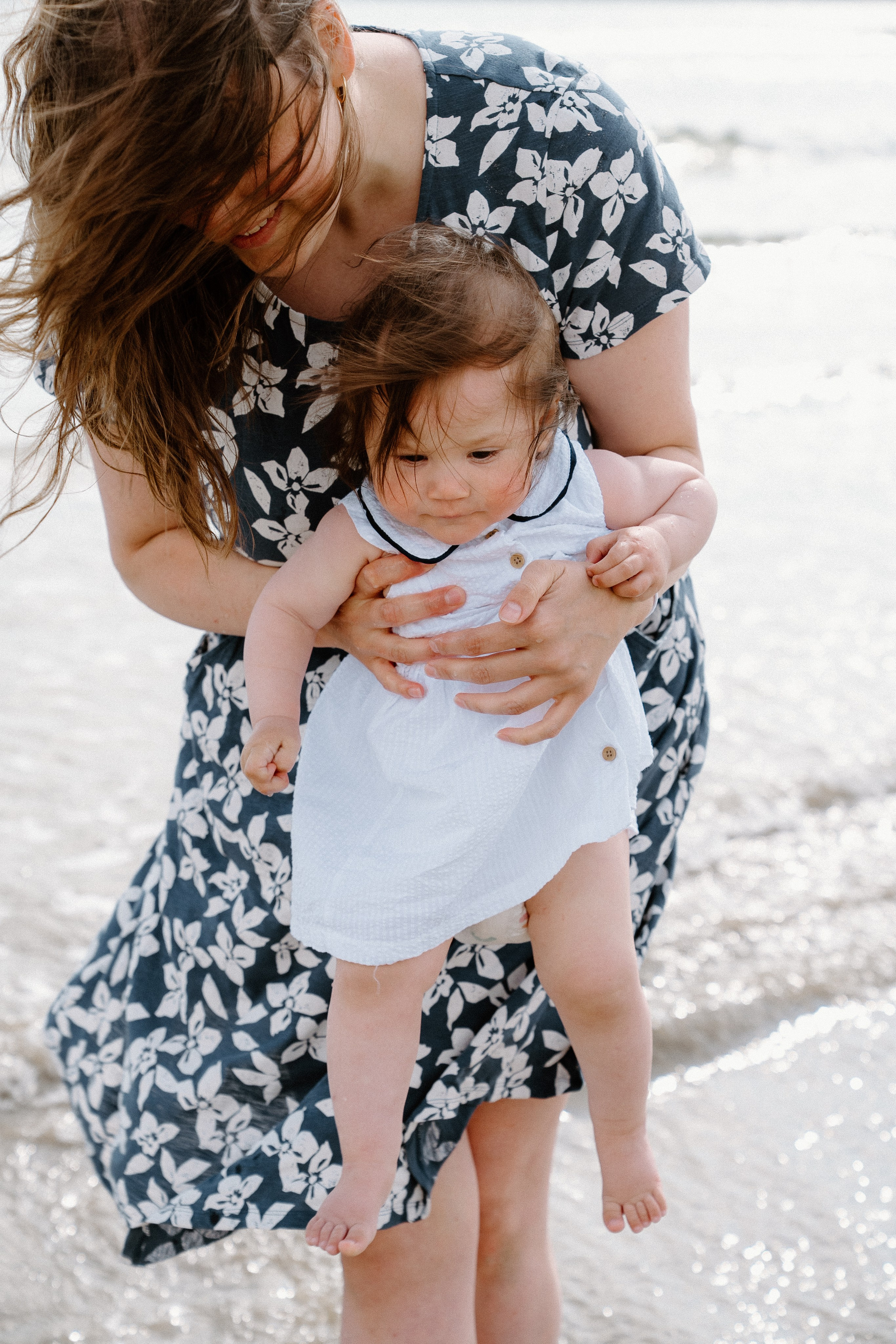 Darya and Mia at the ocean. Wedding and family photographer Ireland