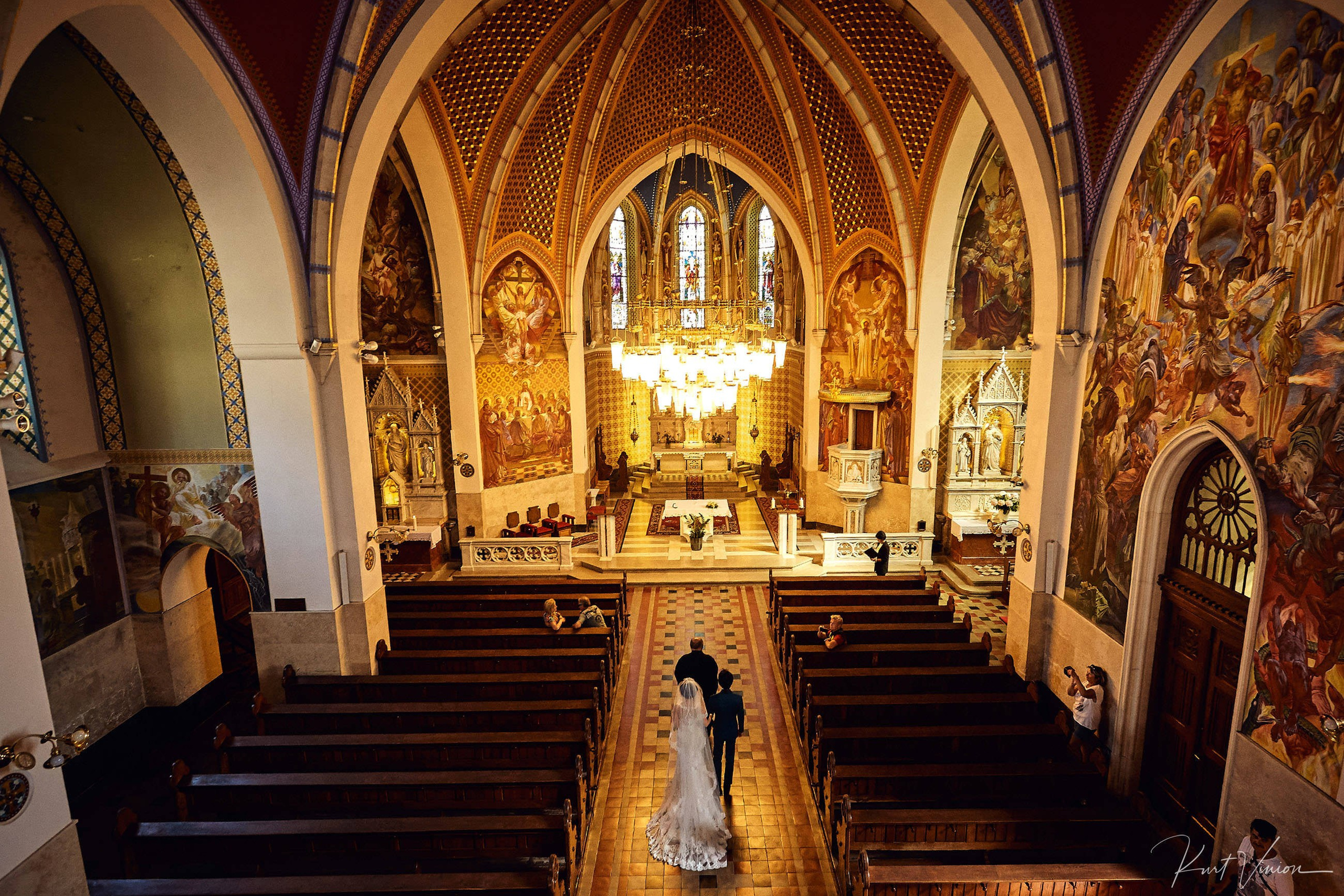 Overhead view church interior Japanese couple processional Bled.