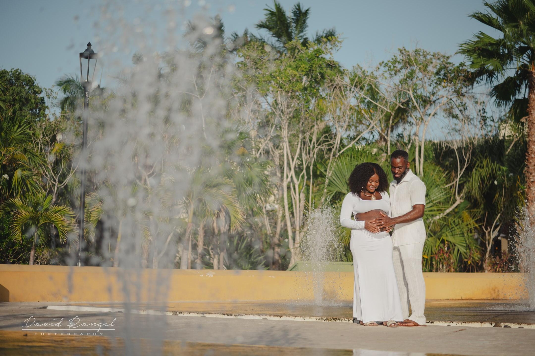 Maternity session of Ketsia & Ricketson at the beautiful colonial-style Valentin Imperial Maya Hotel. Destination wedding photographer based in Cancun and Riviera Maya with service worldwide