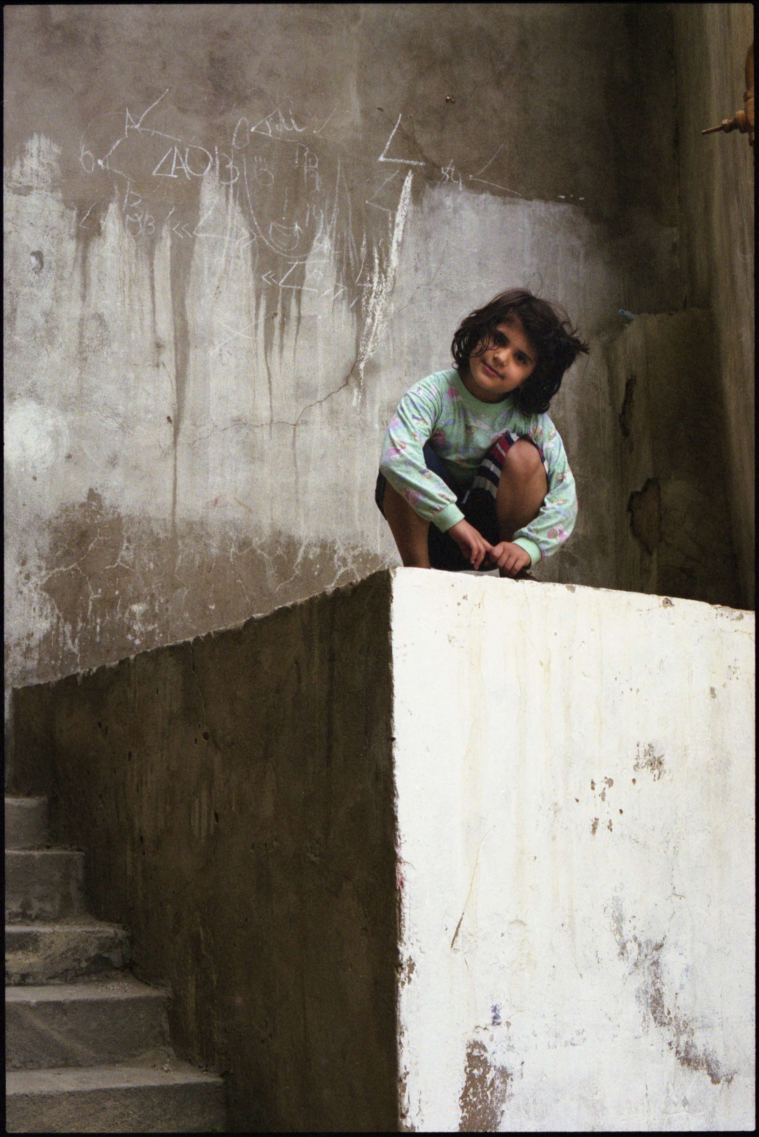 Girl on cube. Baku, 2003