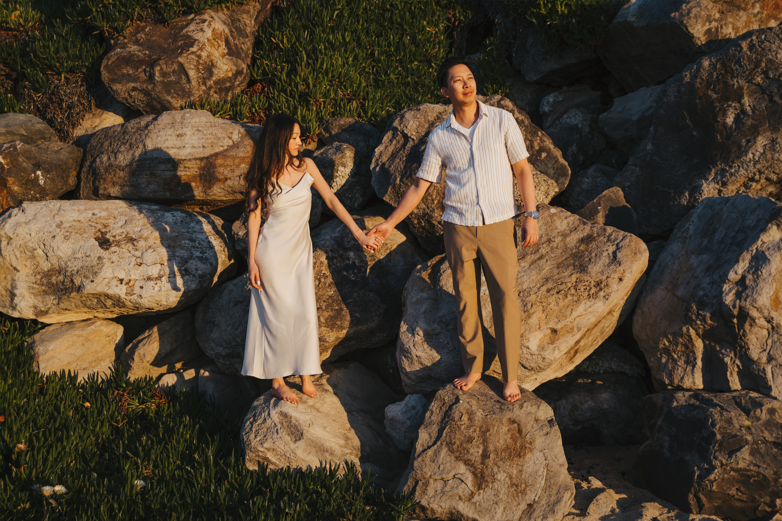 A photo shoot on the San Francisco beach at sunset. Engagement session. 