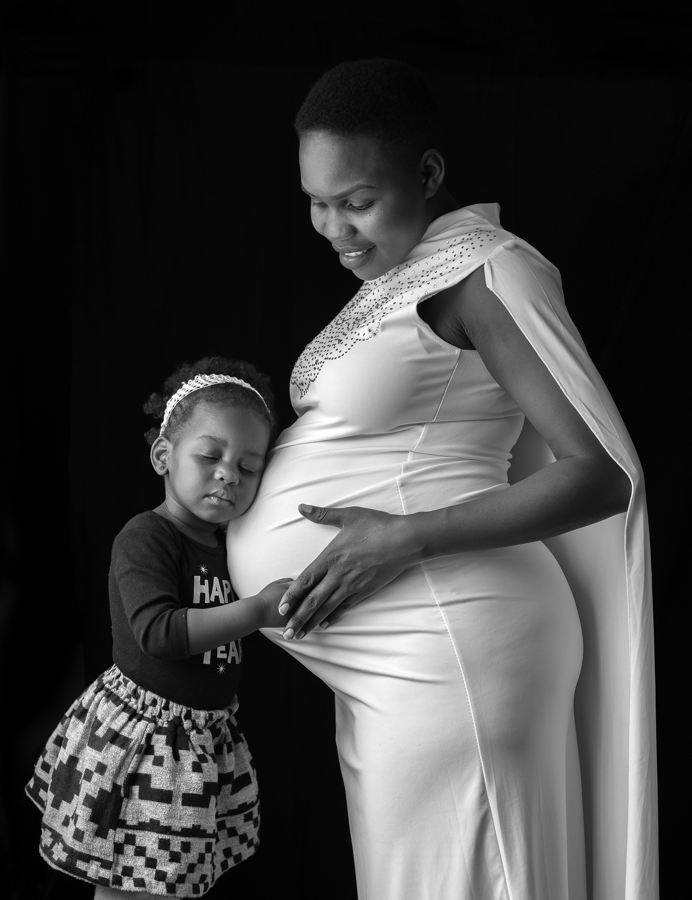 Black and white maternity portrait of pregnant woman with young daughter — Nick Ouma Photography, Nairobi 