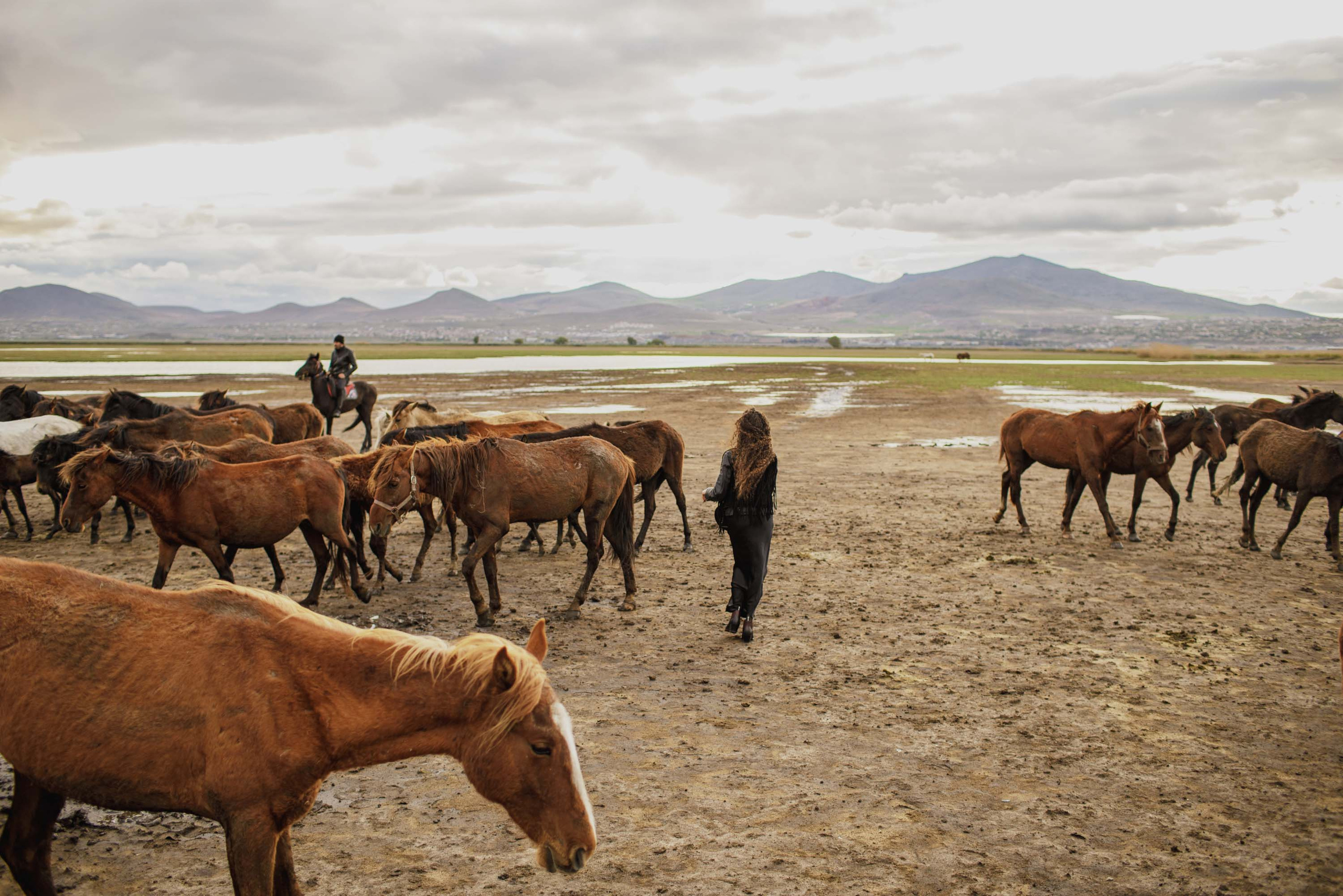 Solo Photoshoot in Kayseri with Wild Horse Herds. Julia Ganch I Fashion Wedding Photography I Cappadocia Turkey