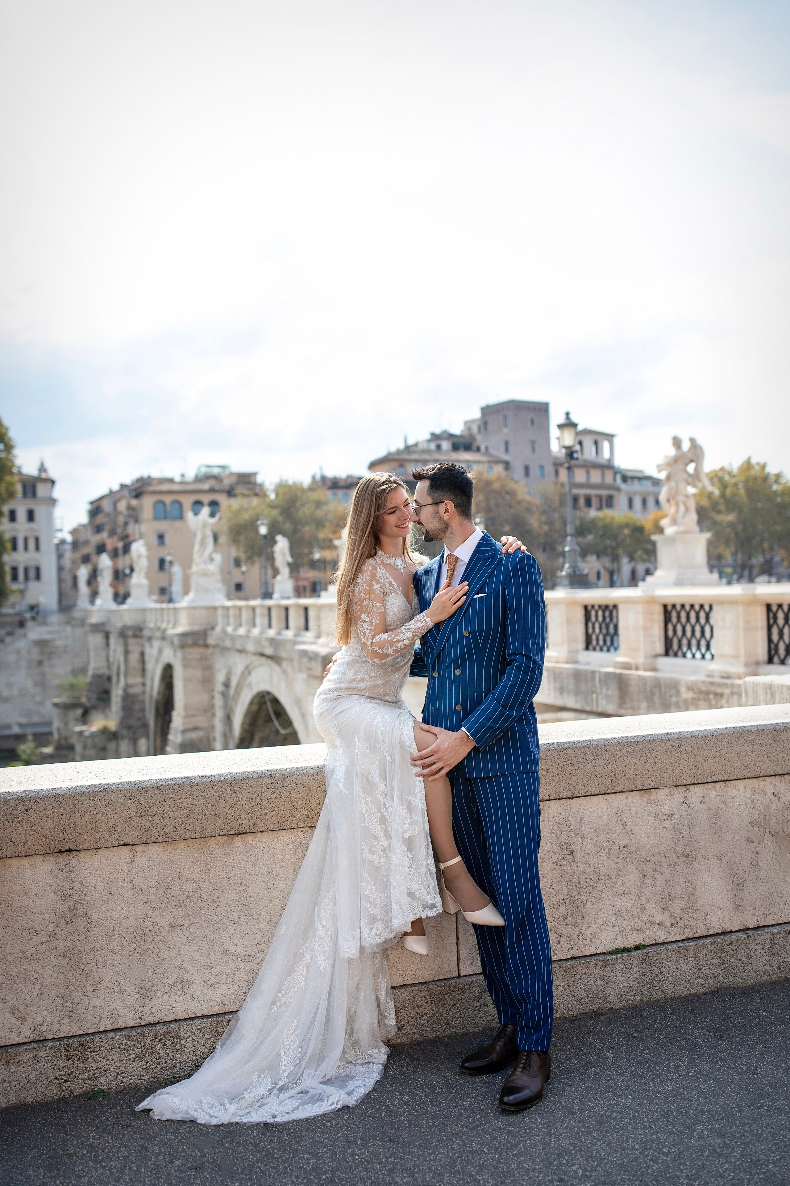 Wedding couple posing near Castel Sant'Angelo during a wedding photoshoot in Rome