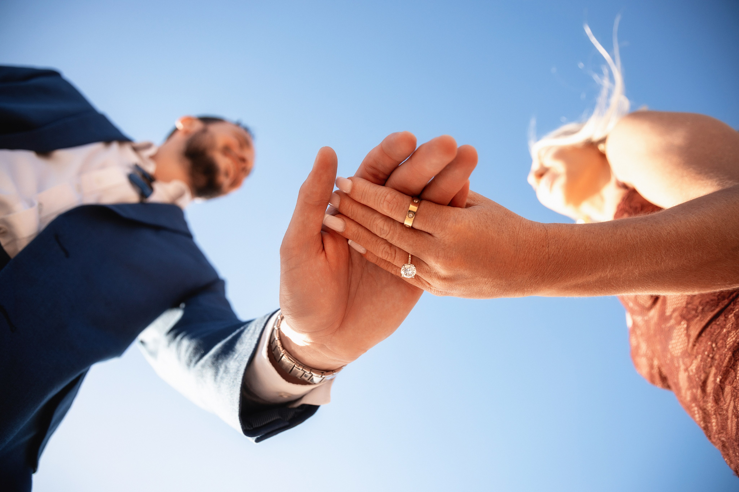 Happy bride showing off her ring with the Bay Area in the background