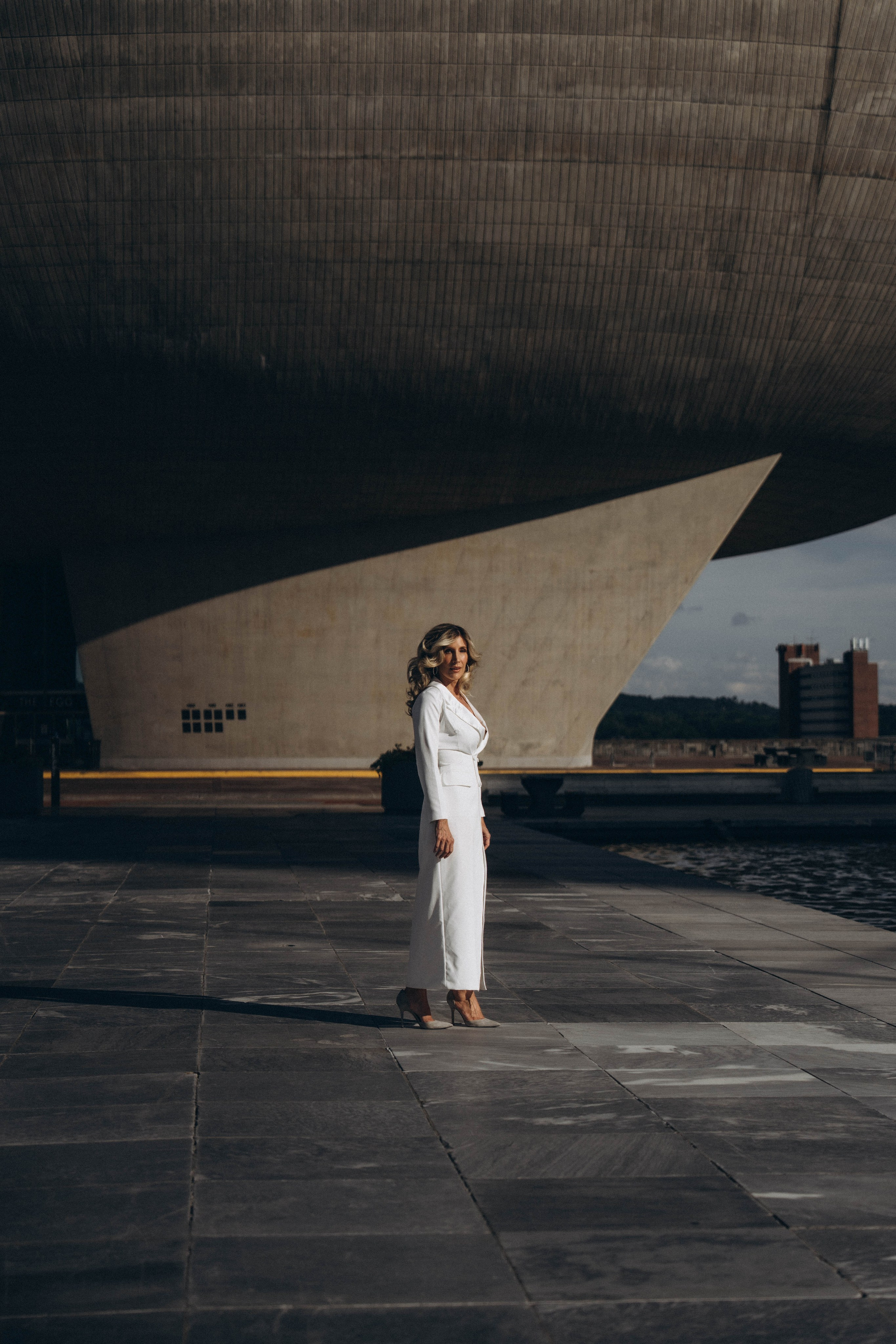Bride holding flowers in Troy’s downtown cobblestone streets.