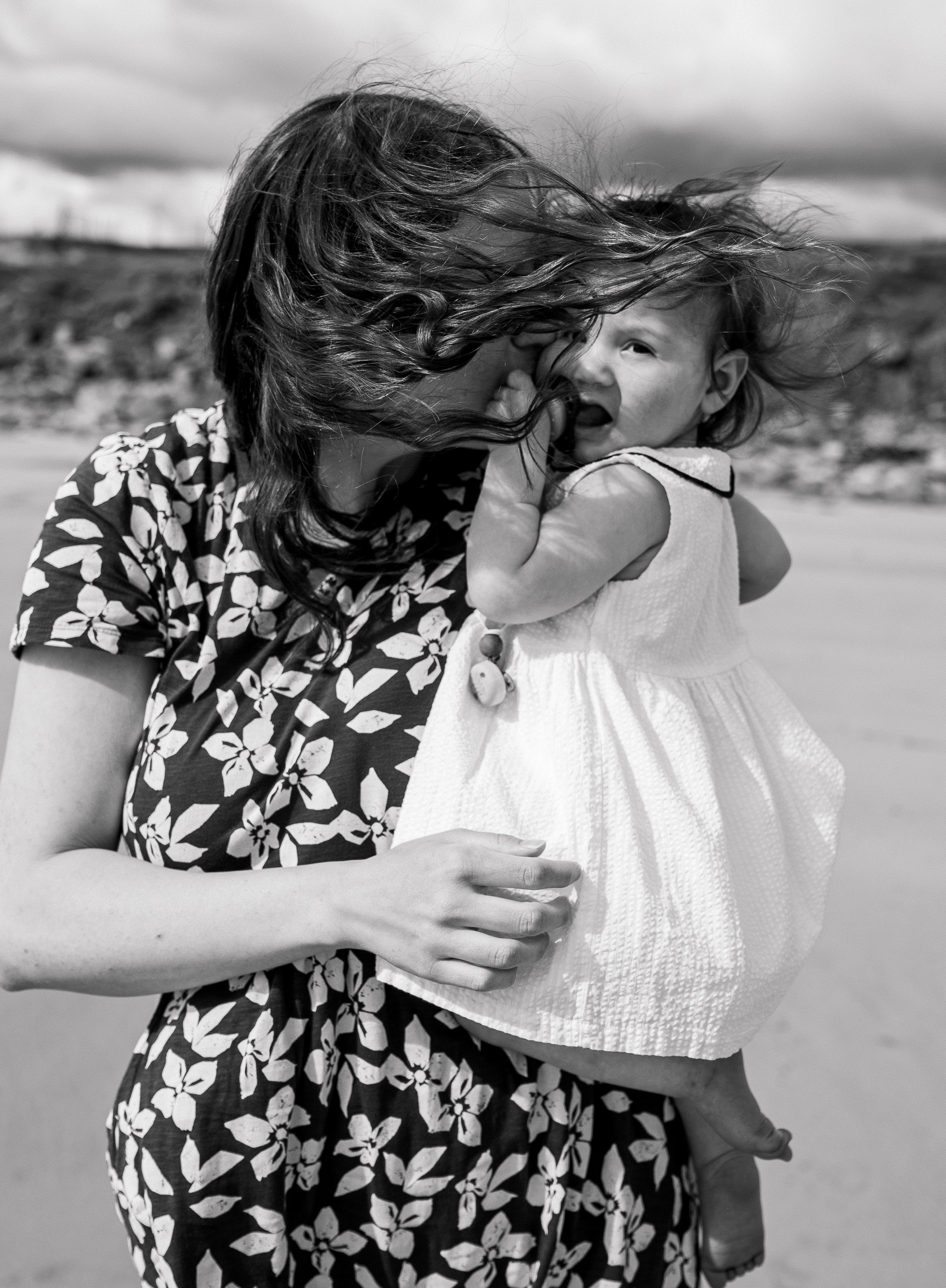 Darya and Mia at the ocean. Wedding and family photographer Ireland