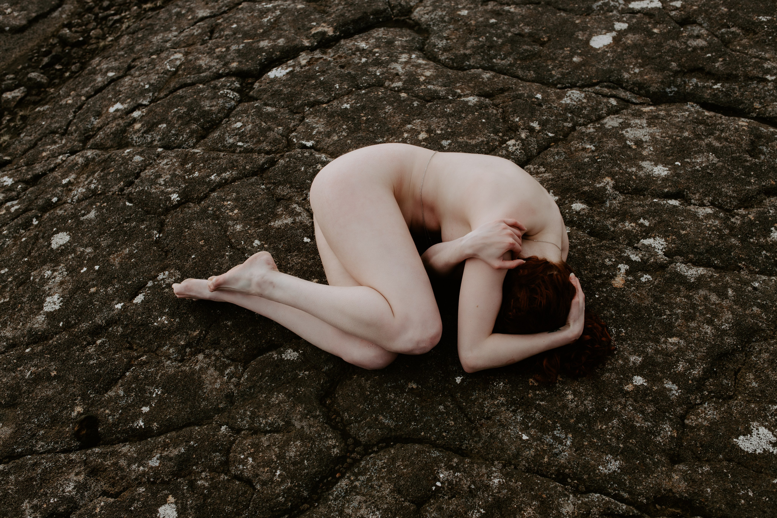 Bold and beautiful—woman embracing self-love in a breathtaking Icelandic nature boudoir shoot