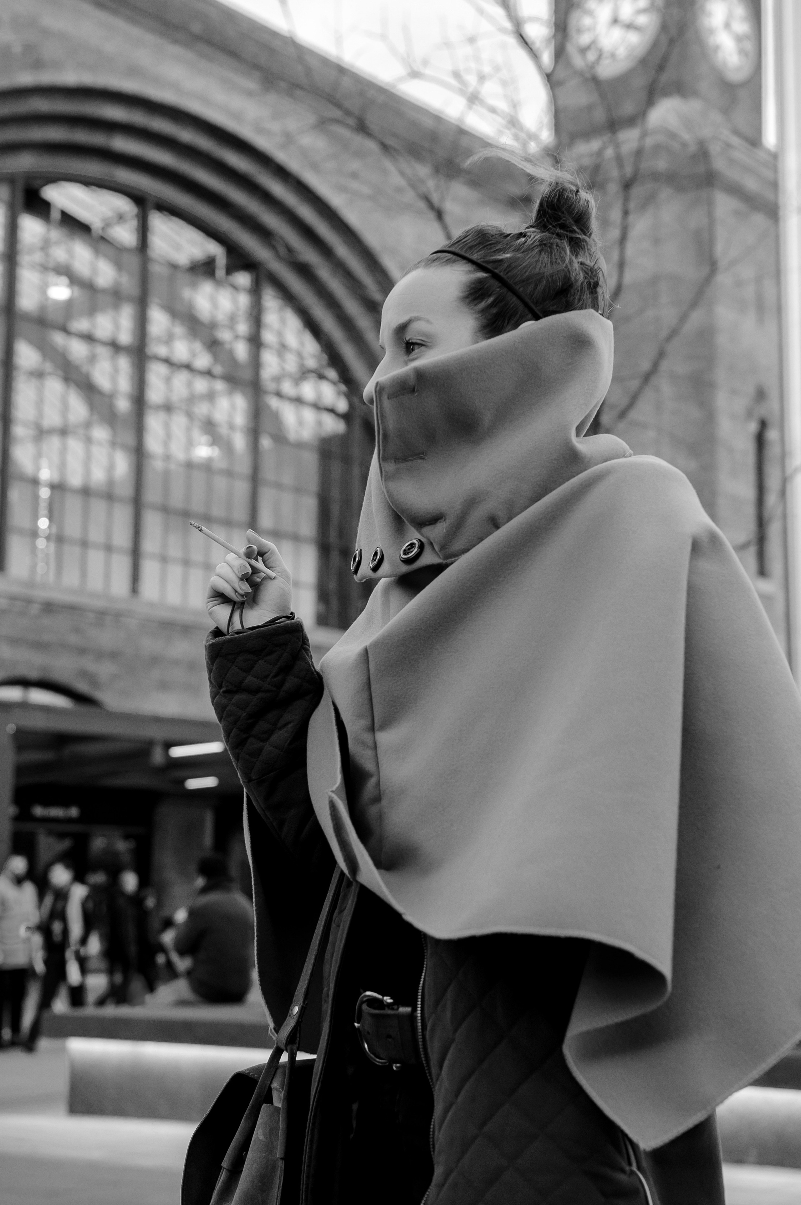 Woman in a cape. Side portrait.