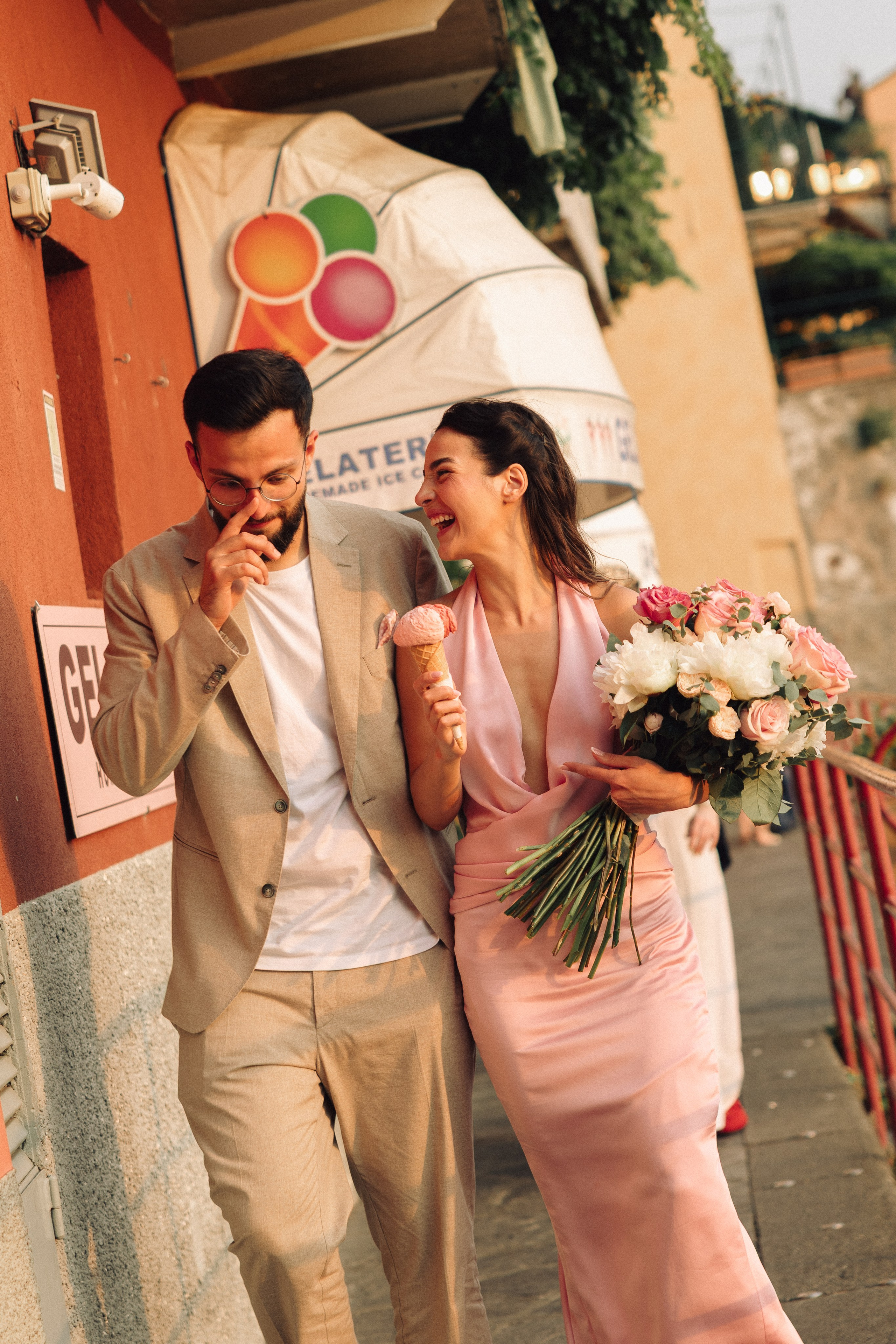 Couple walking together after a romantic marriage proposal in Italy 