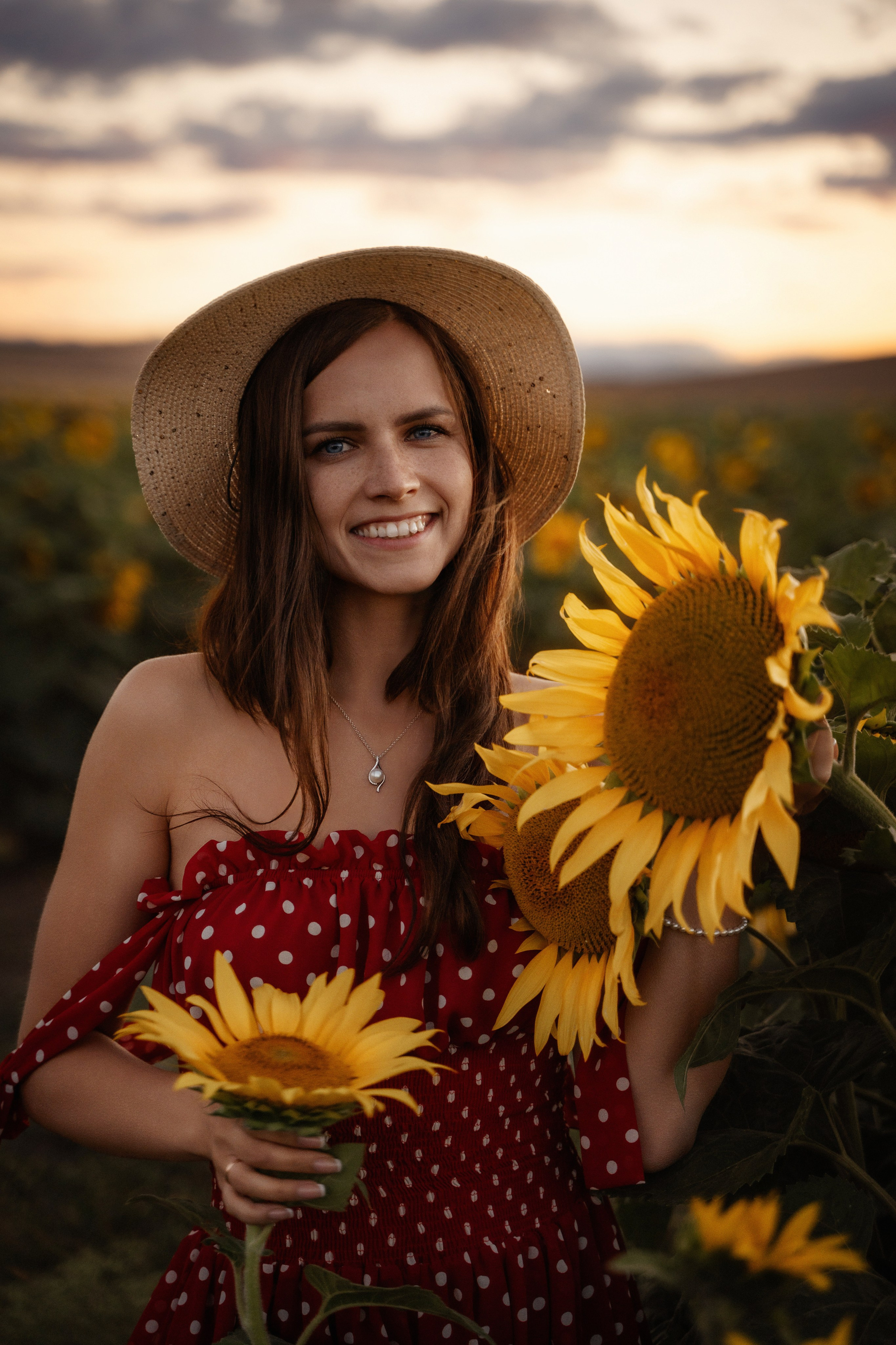 Marbella portrait photography of beautiful female model posing in sunflower field at sunset