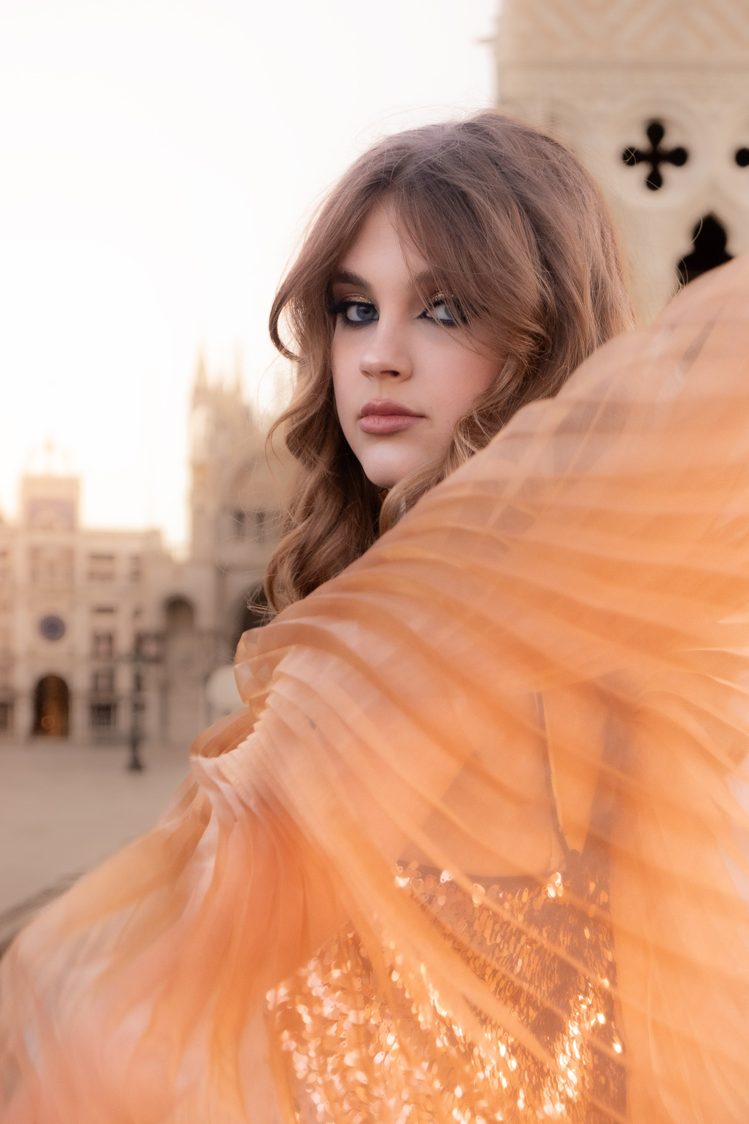 High-fashion photoshoot Venice with golden hour light near Piazza San Marco.