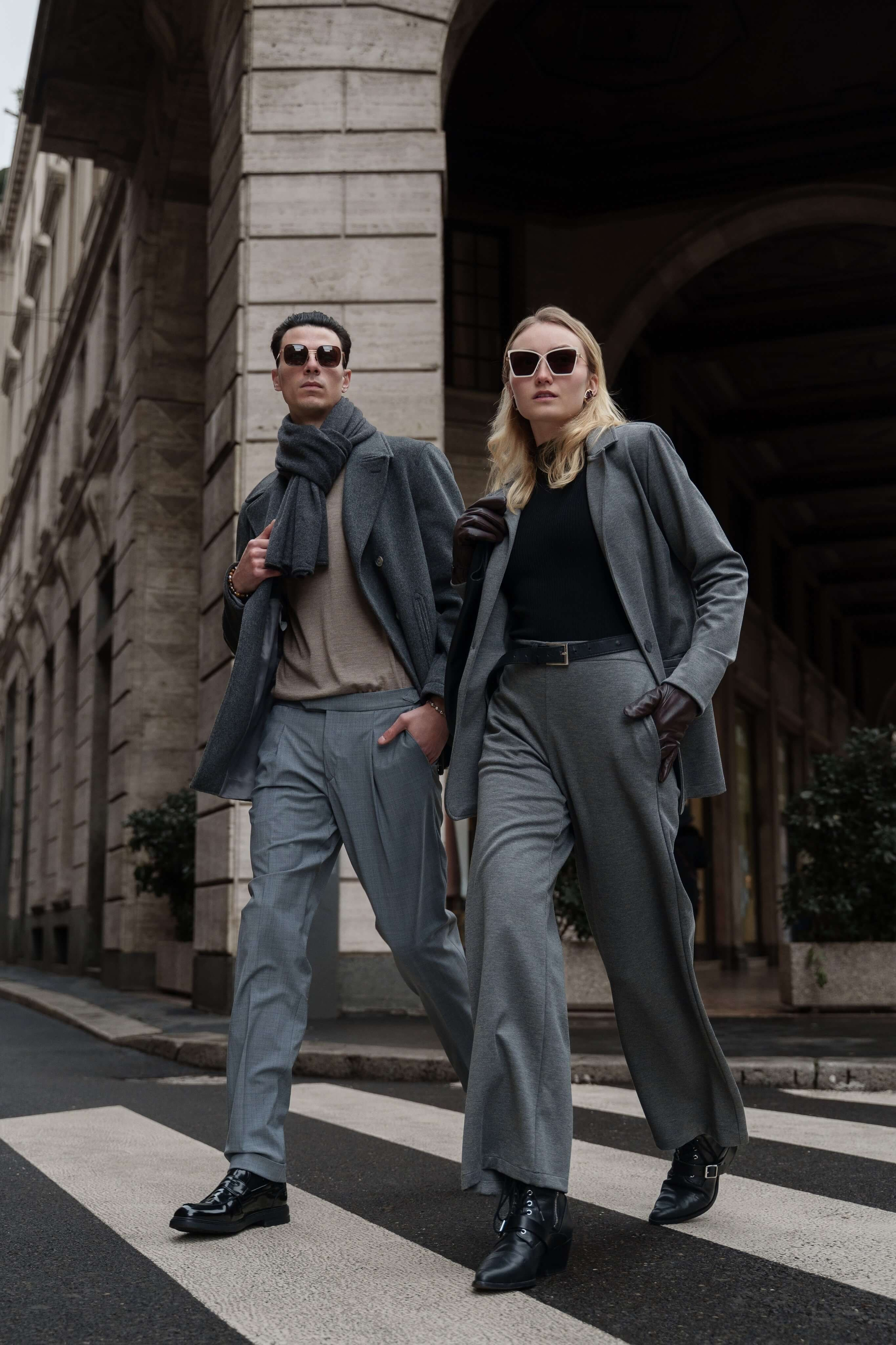 Editorial eyewear shoot in Milan – male and female models walking confidently across urban street