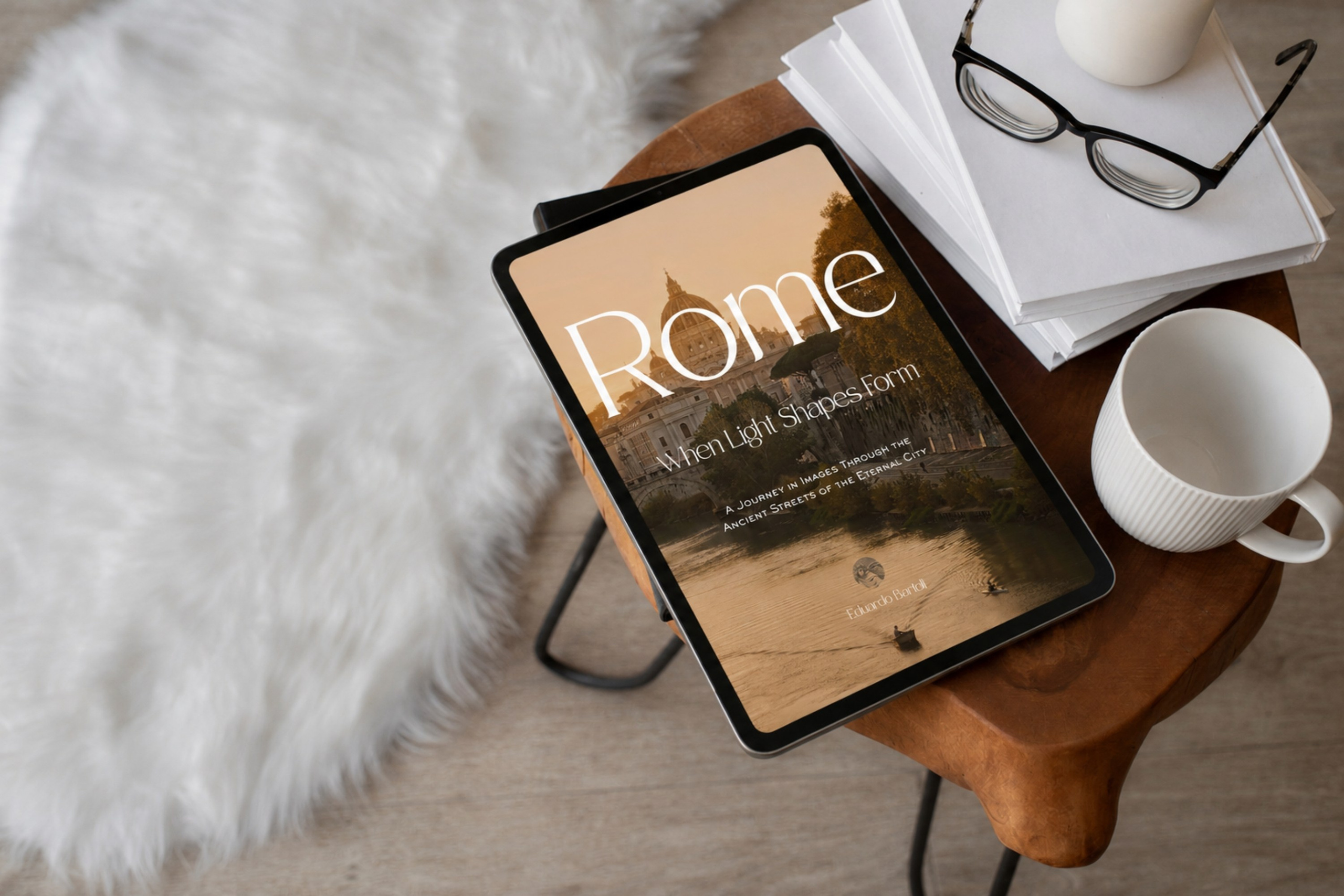 Rome, Italy – Photography Book – Rome — When Light Shapes Form – Digital book cover displayed on an iPad, featuring St. Peter's Basilica and the Tiber River at sunset – Eduardo Bartoli Photography
