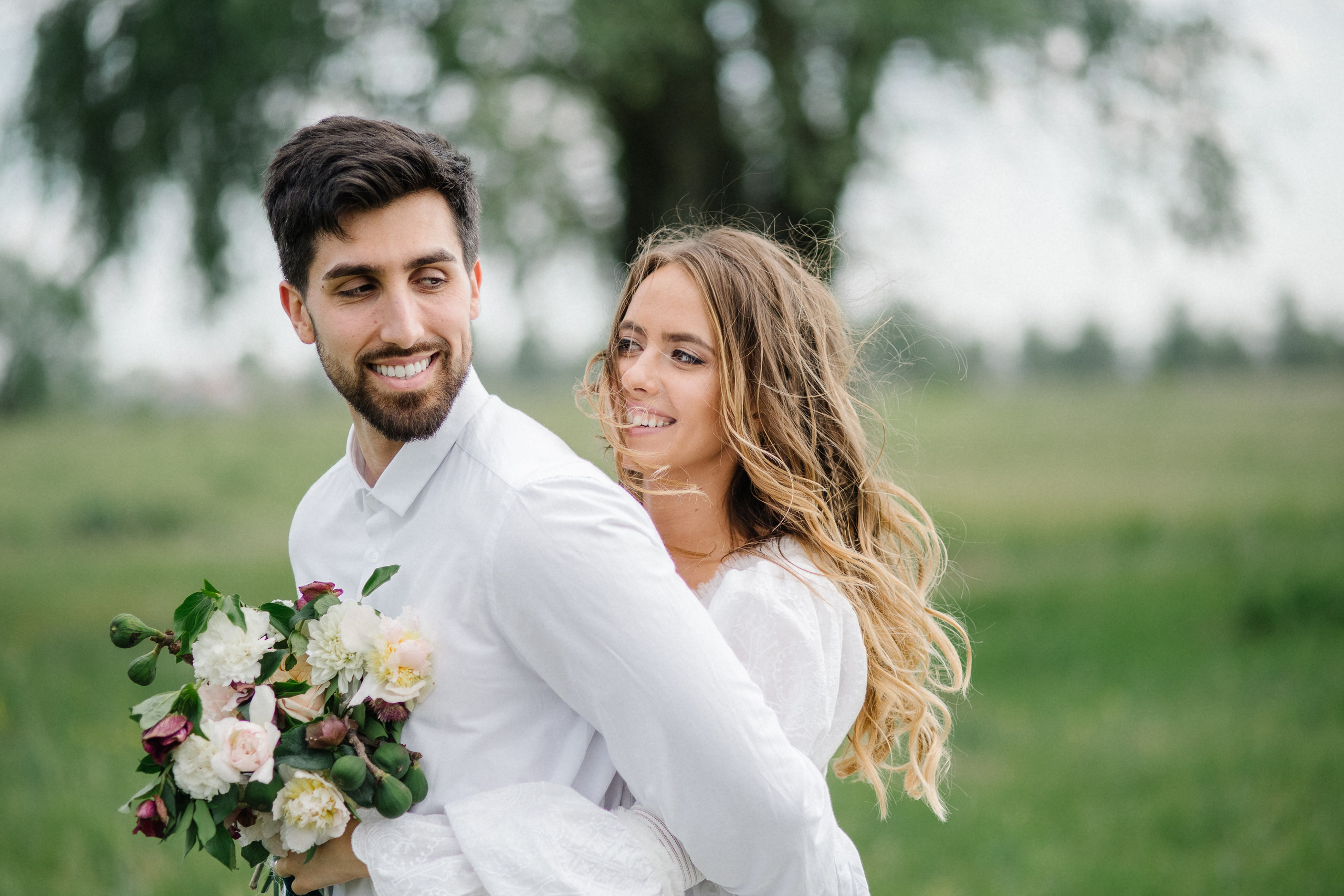 Wedding couple holding hands walking through Central Park Bethesda Terrace. Description: Central Park wedding photographer in NYC. Beautiful elopement and engagement photos at Bethesda Fountain and Terrace.