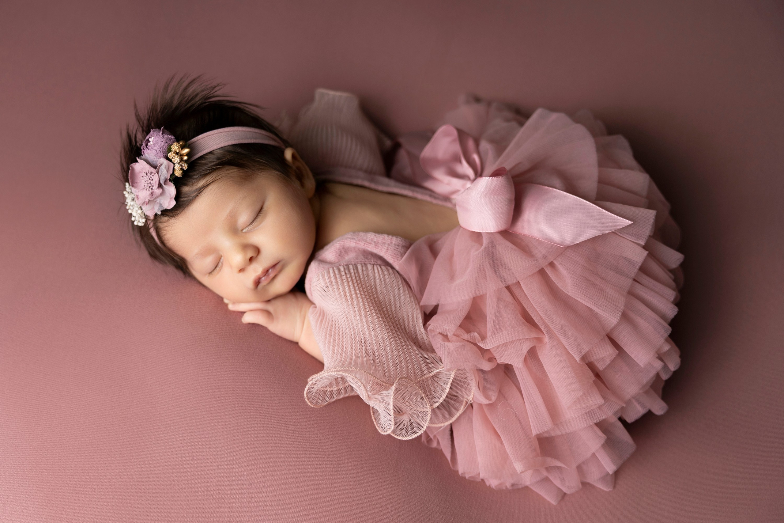 newborn girl in pink tutu dress