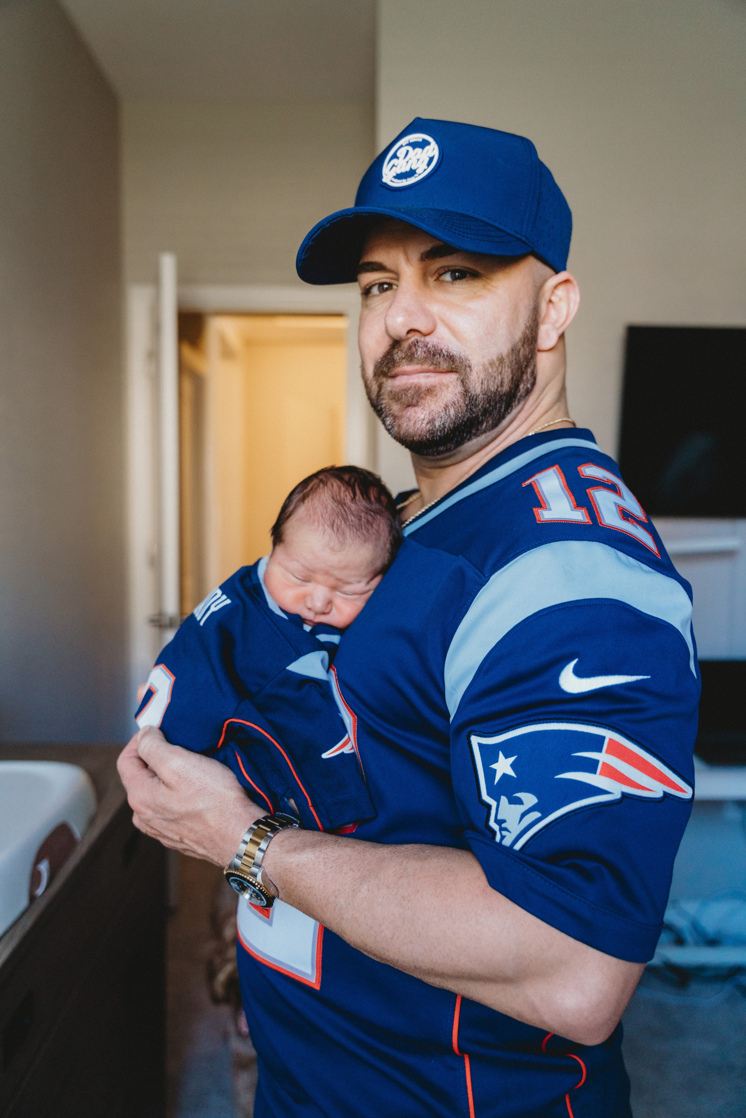 Portraits of father holding his baby