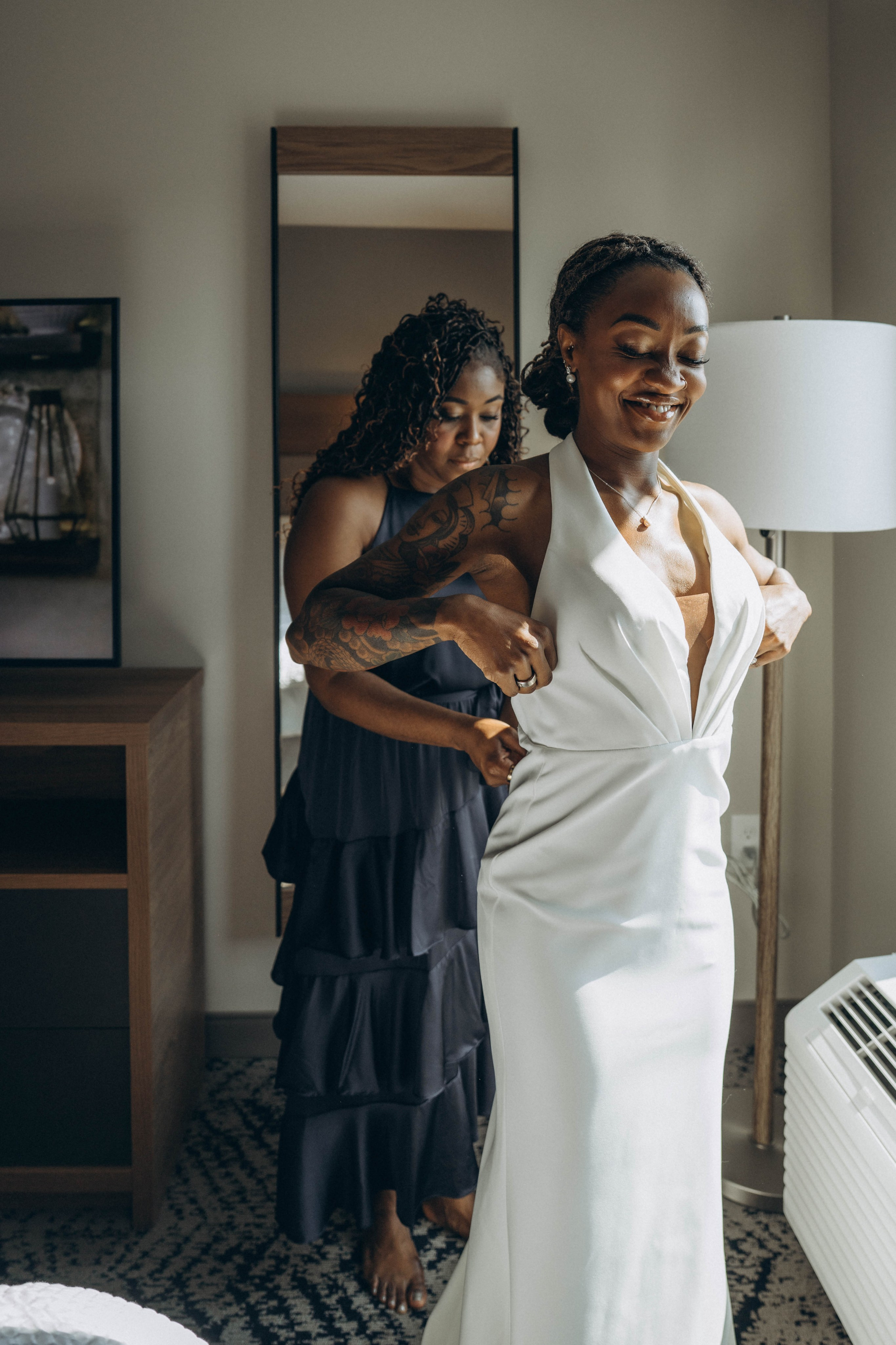Bride with flowing veil in Catskills autumn forest.