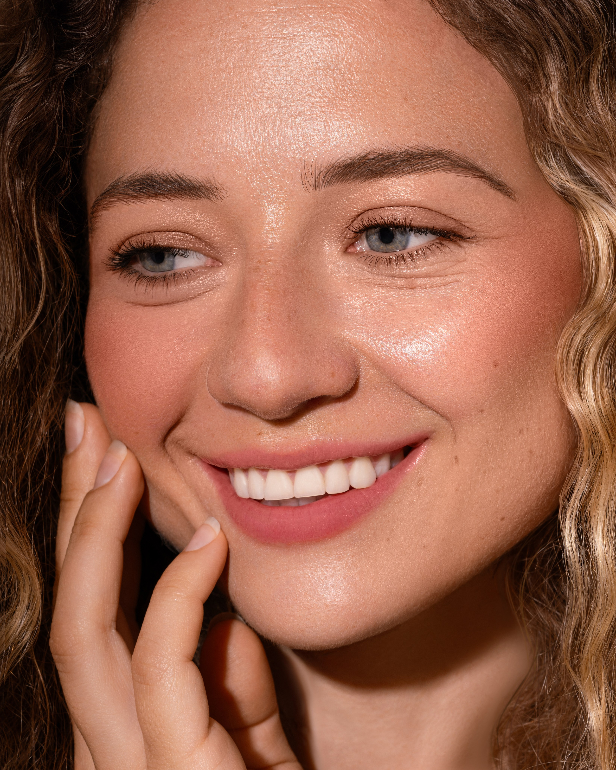 Natural portrait retouching — clean skin, preserved texture, soft color correction