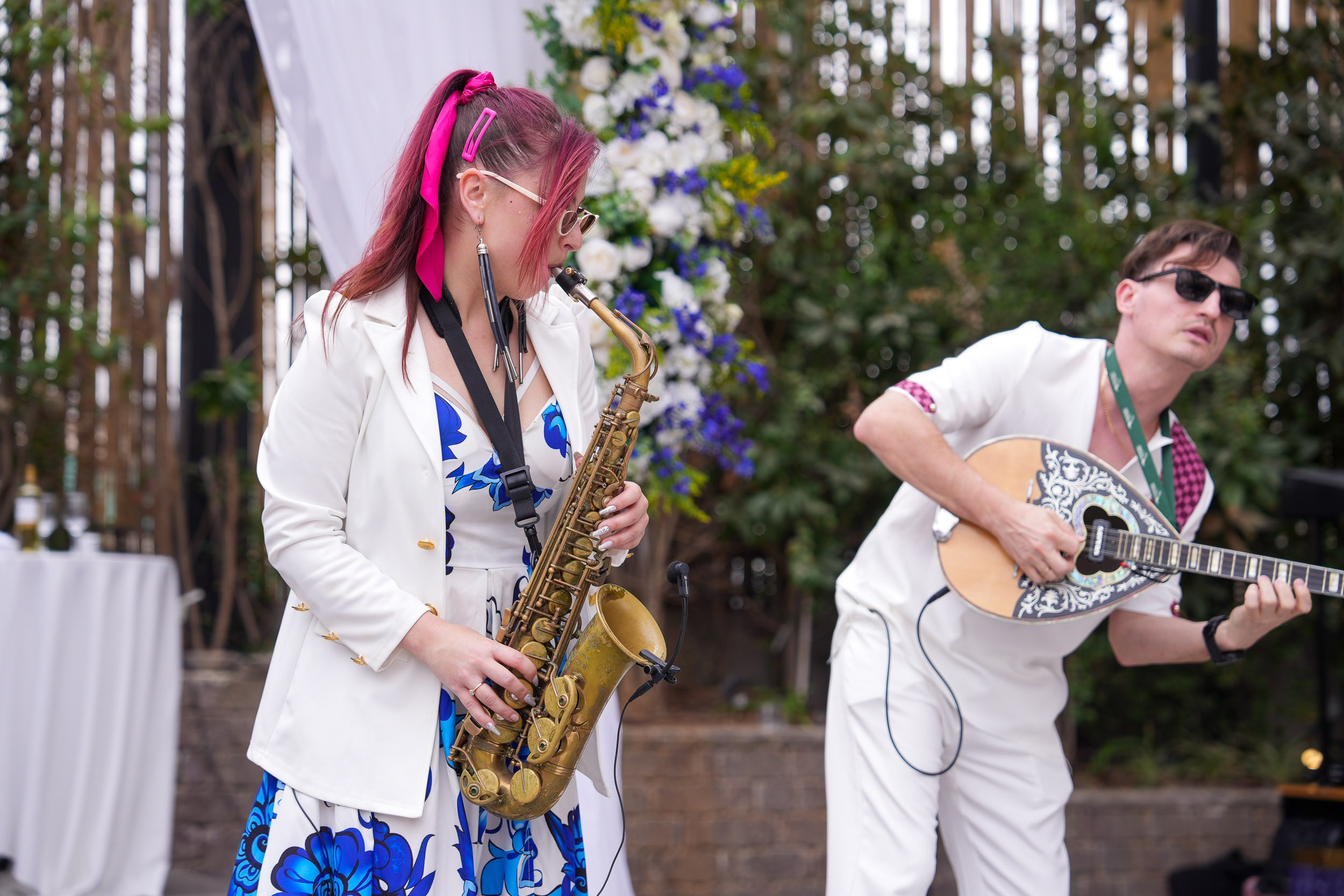 Live musicians performing with a saxophone and a bouzouki at Artista Event Garden in Hadera, Israel
