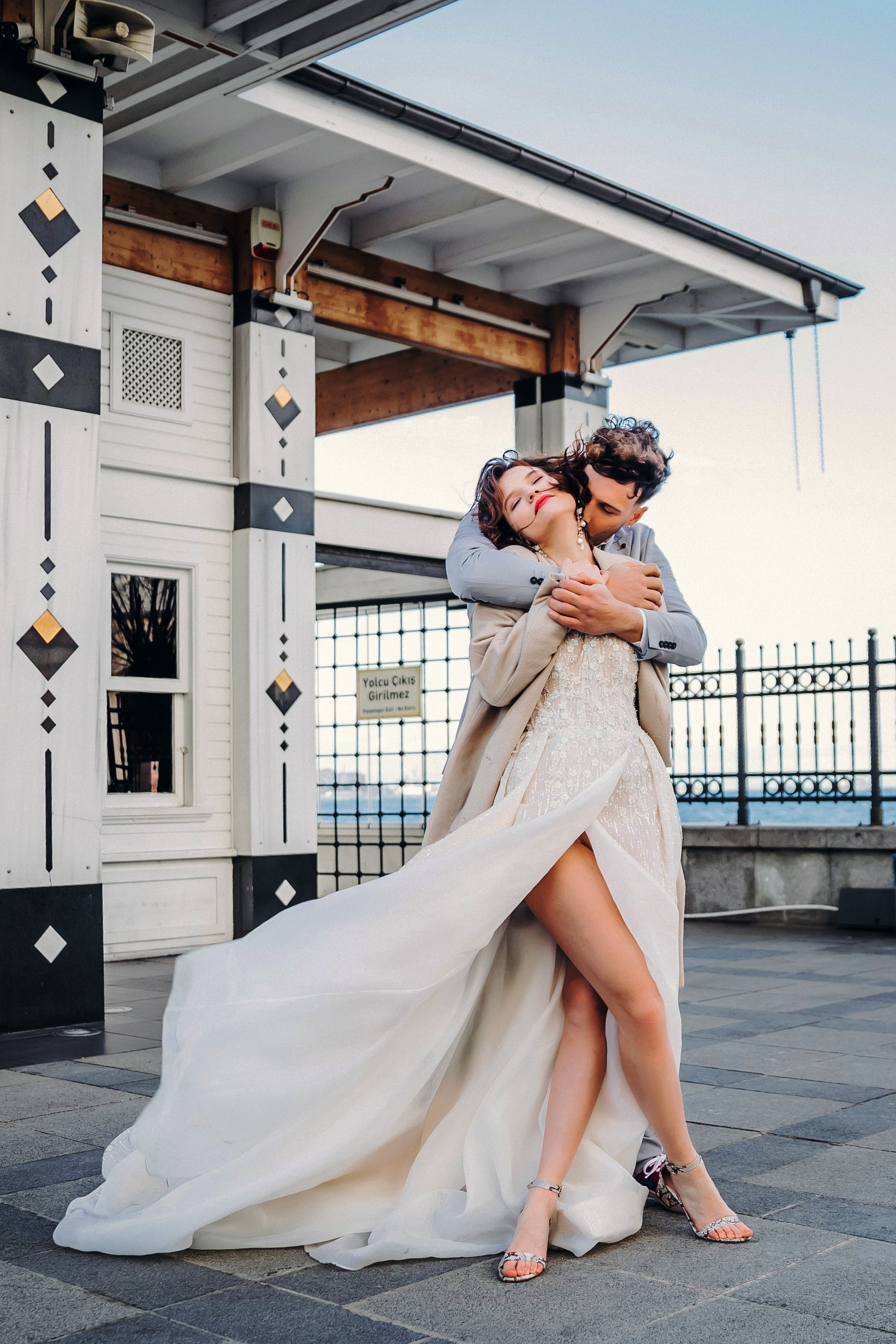  Bride and groom holding hands at Istanbul’s town square – European destination wedding.