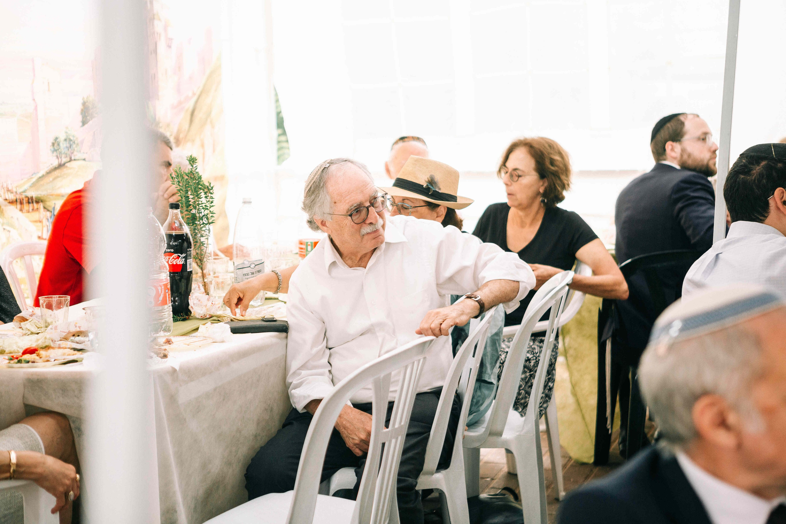 BRITH MILA IN THE SMALL SYNAGOGUE. PHOTOGRAPHER IN ISRAEL