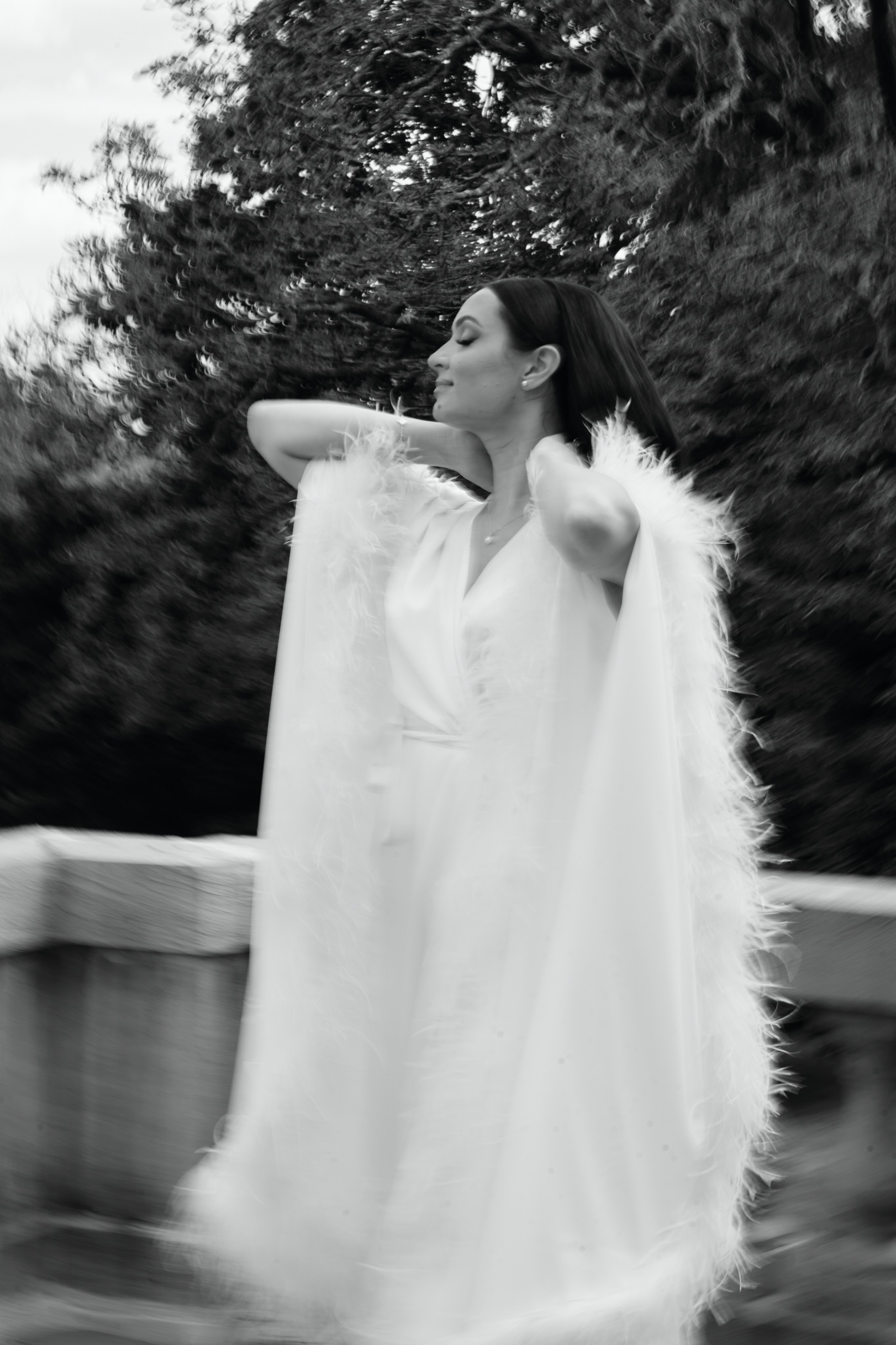 Black and white wedding photography of bride and groom embracing outdoors in New Jersey