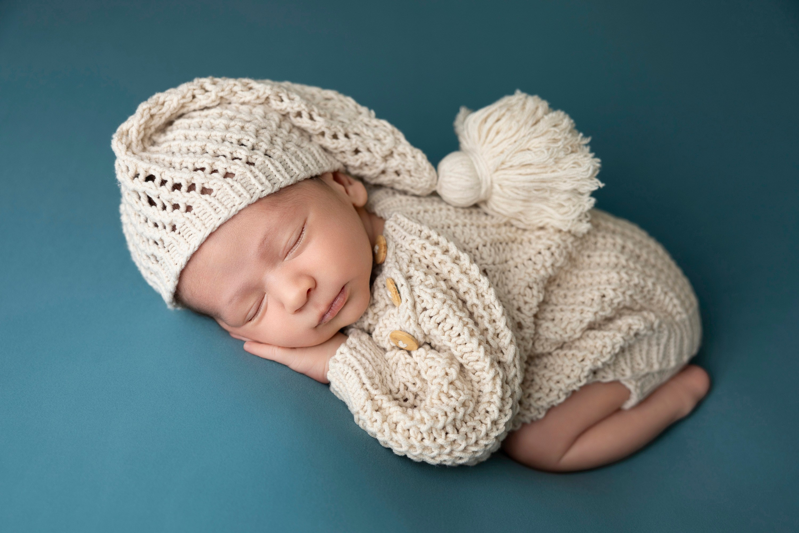 only baby picture in sleepy hat, handmade knitted outfit