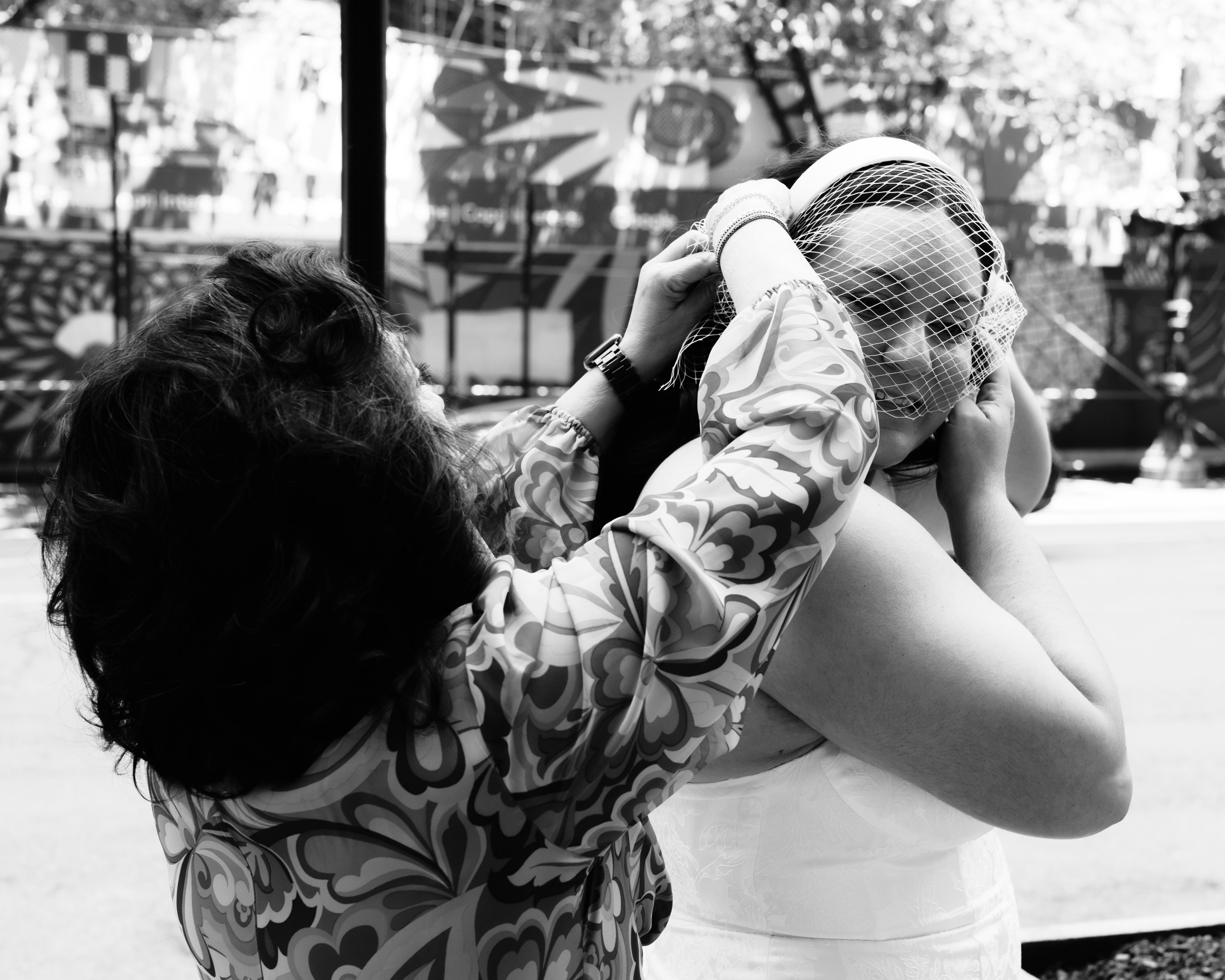 Bride getting ready with mother’s help before wedding ceremony in Chicago