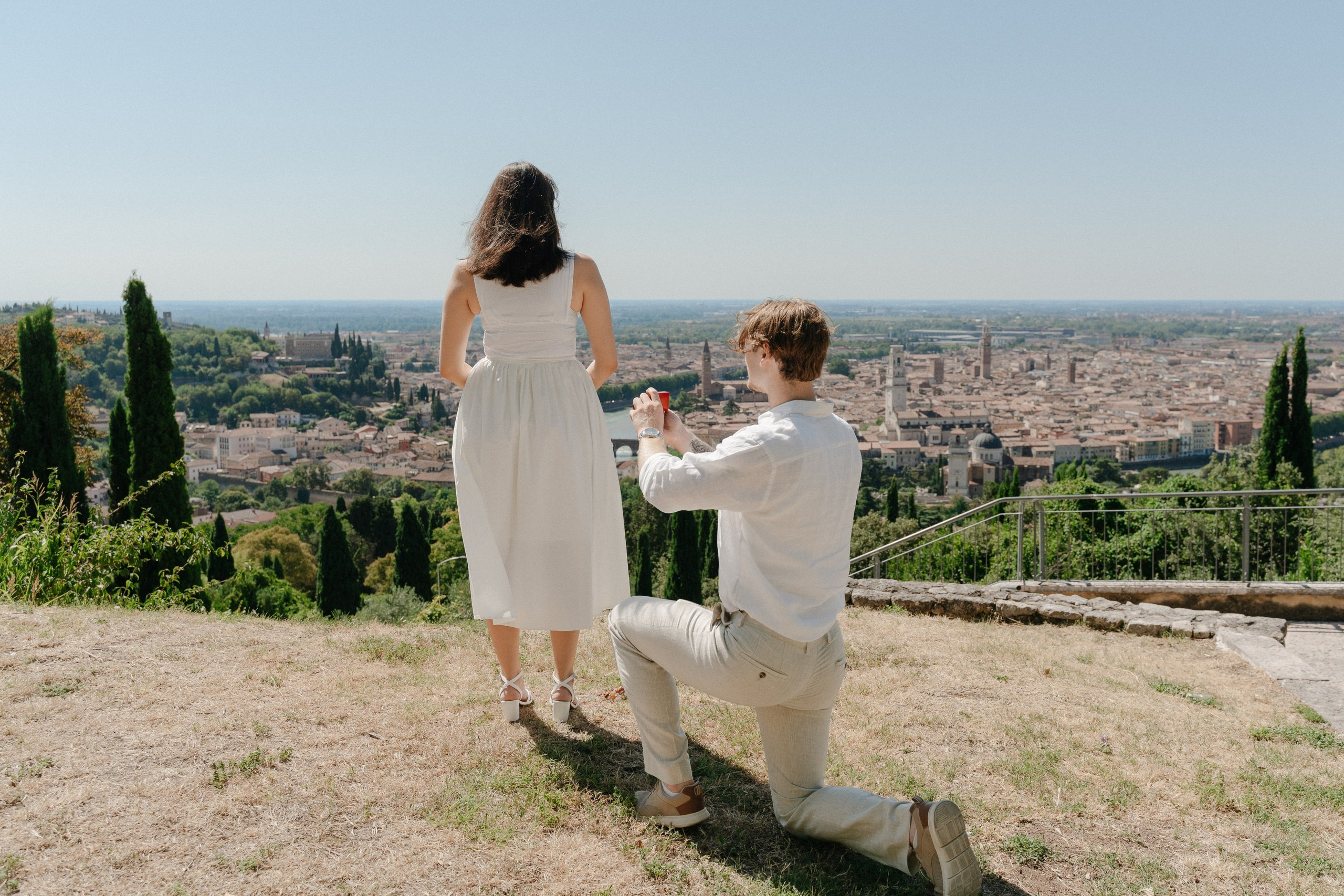 Romantic surprise marriage proposal overlooking Verona with breathtaking panoramic city views and genuine emotions.