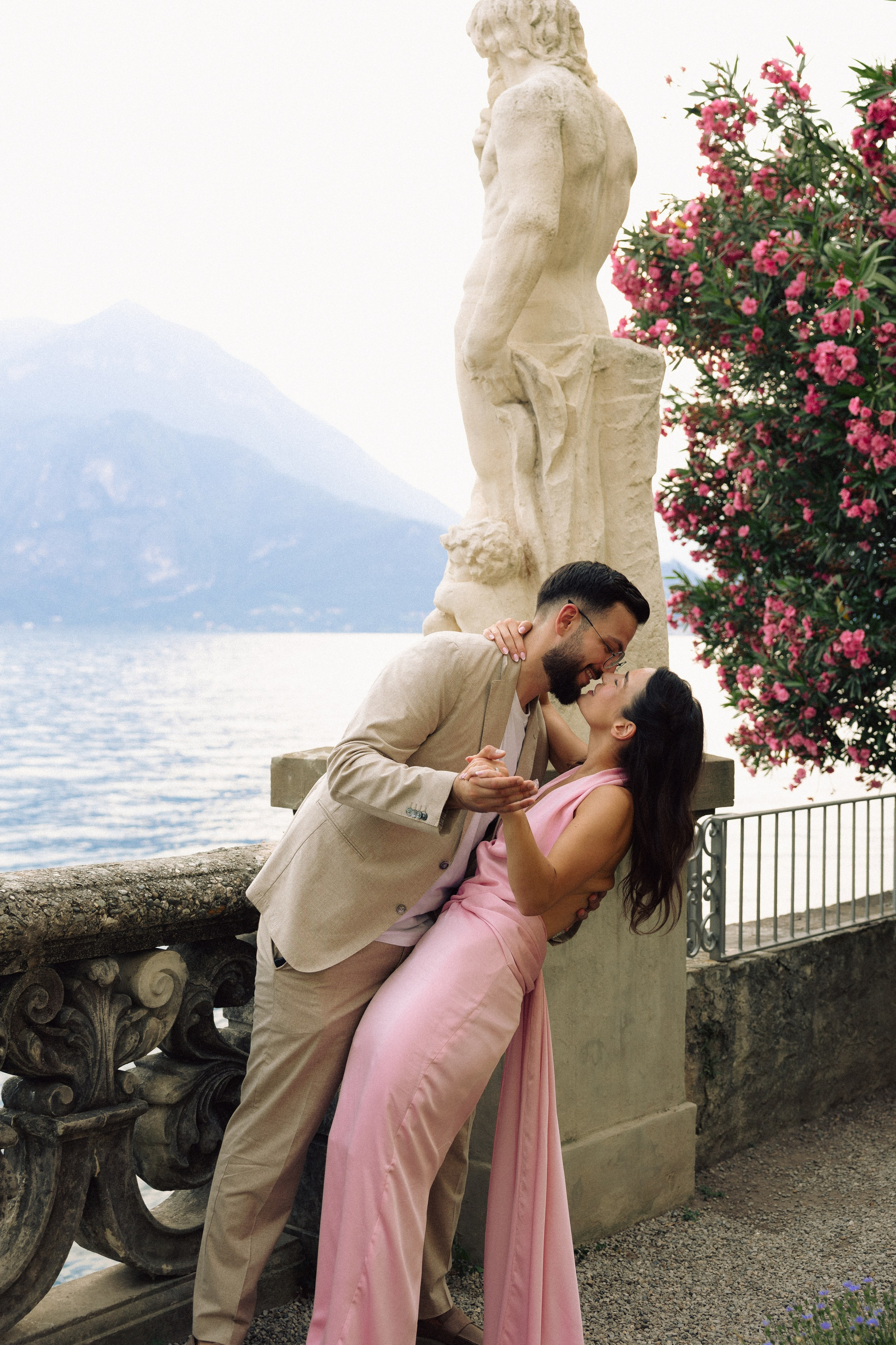 Couple sharing an intimate moment after a surprise proposal in Italy