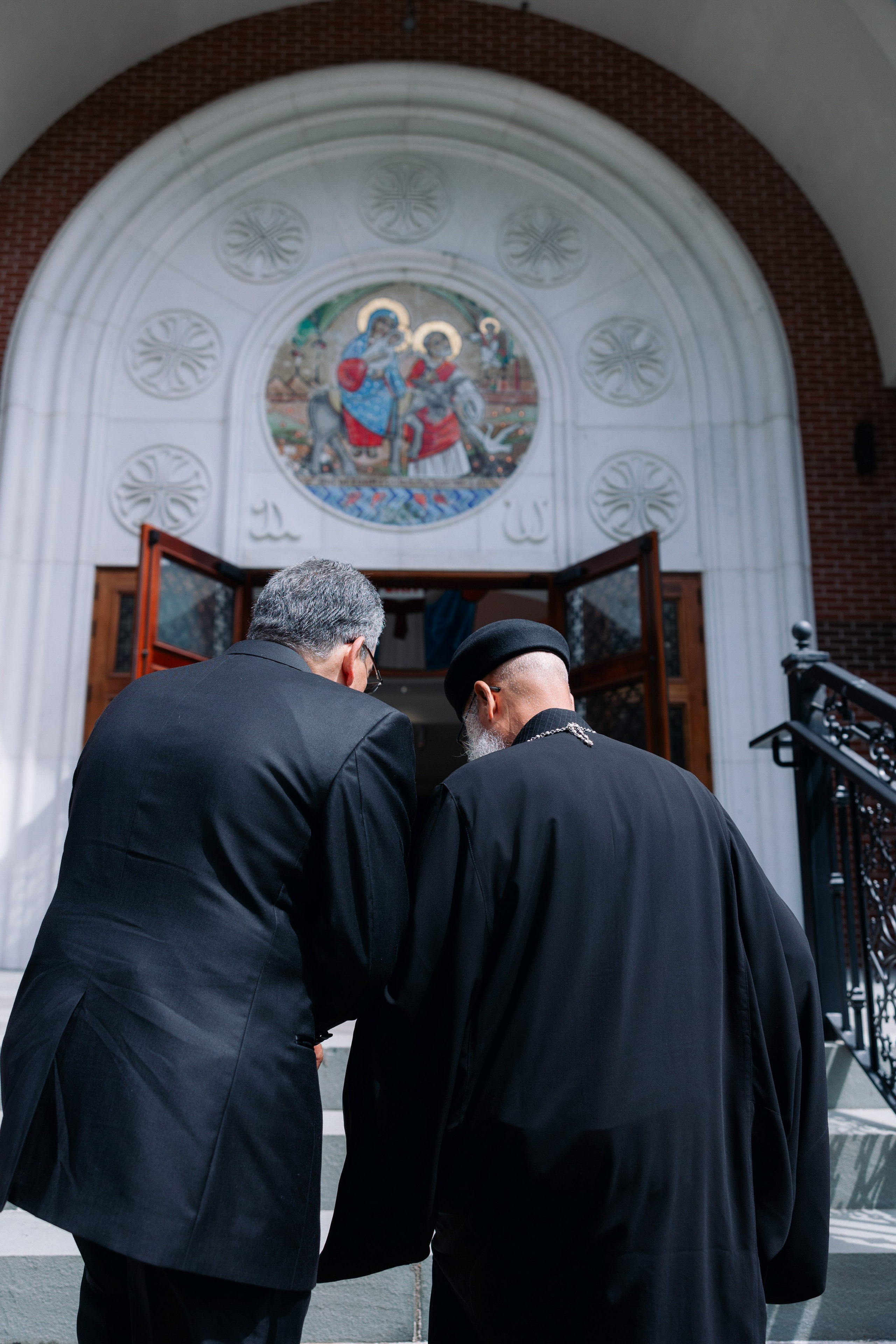 Two priests entering the church before the Coptic wedding ceremony
