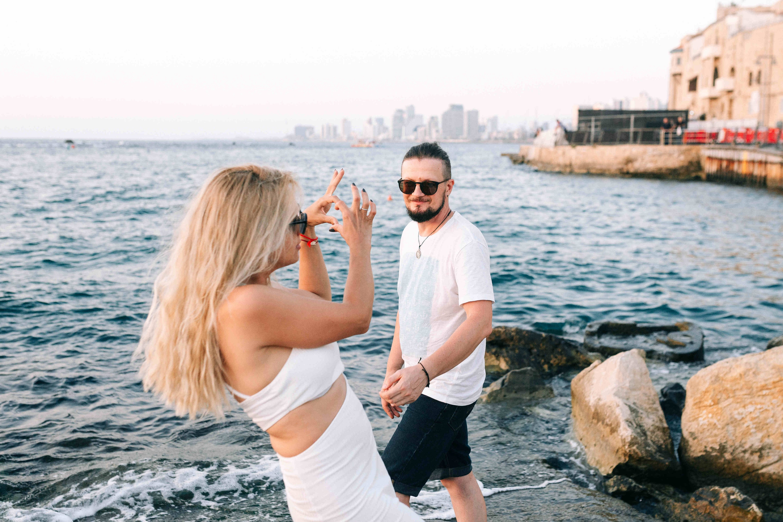 SUNSET IN JAFFO PORT. PHOTOGRAPHER IN ISRAEL